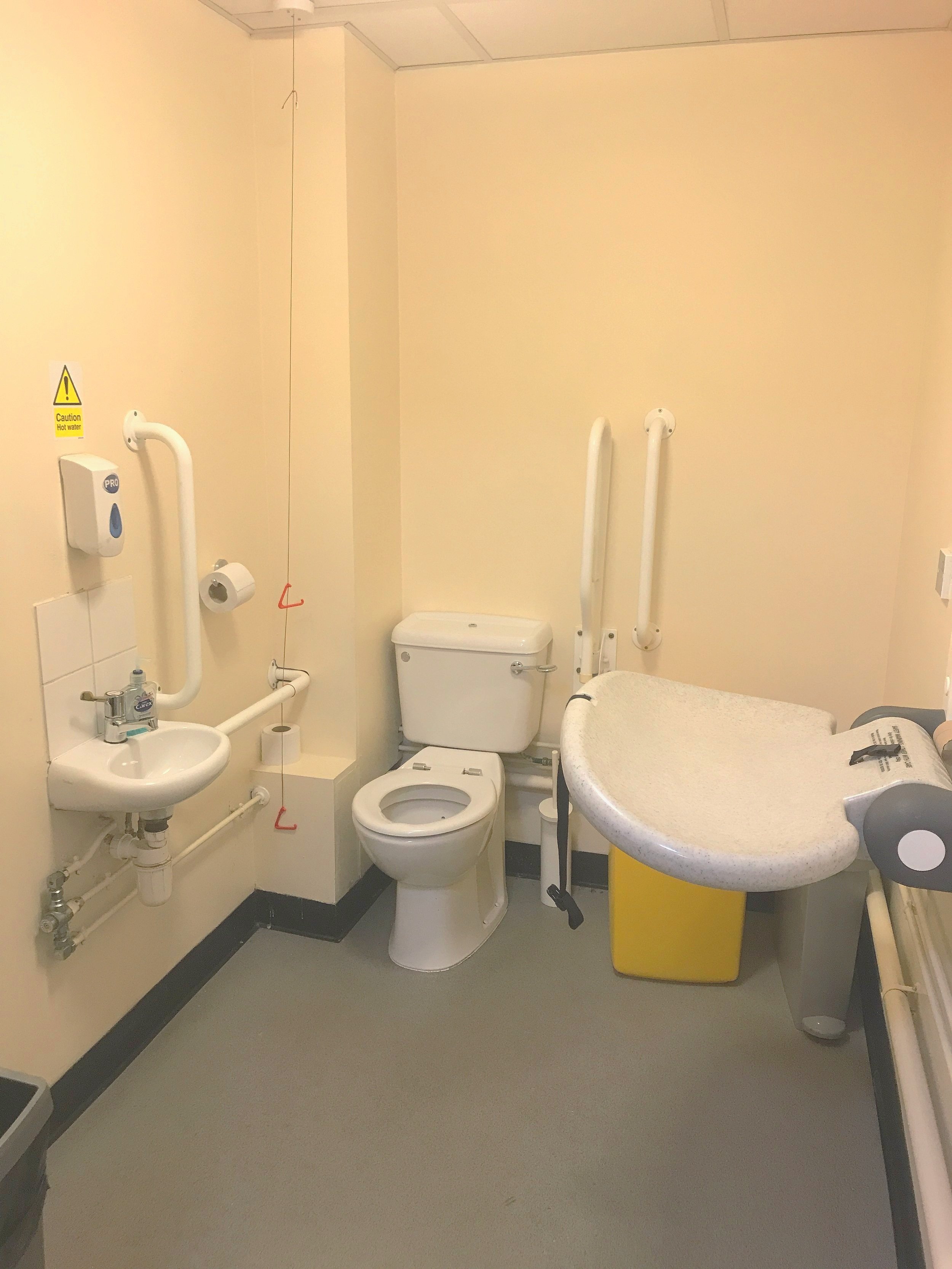  Accessible toilet and baby change, with rail, large space, and emergency cord, in Children’s Scrapstore, Bristol  