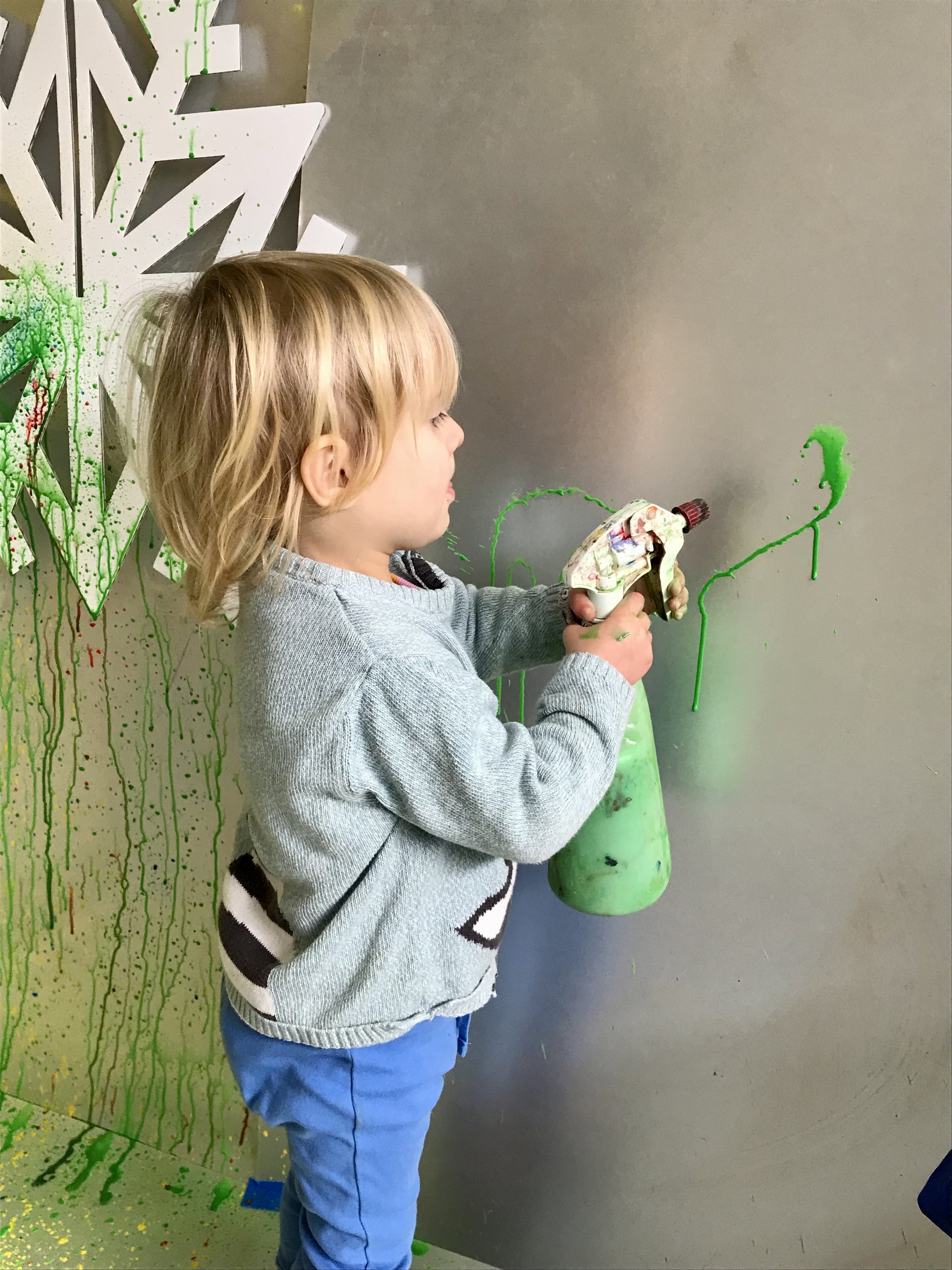 RR Messy Play 13:12:23 child snowflake paint wall 5.jpeg