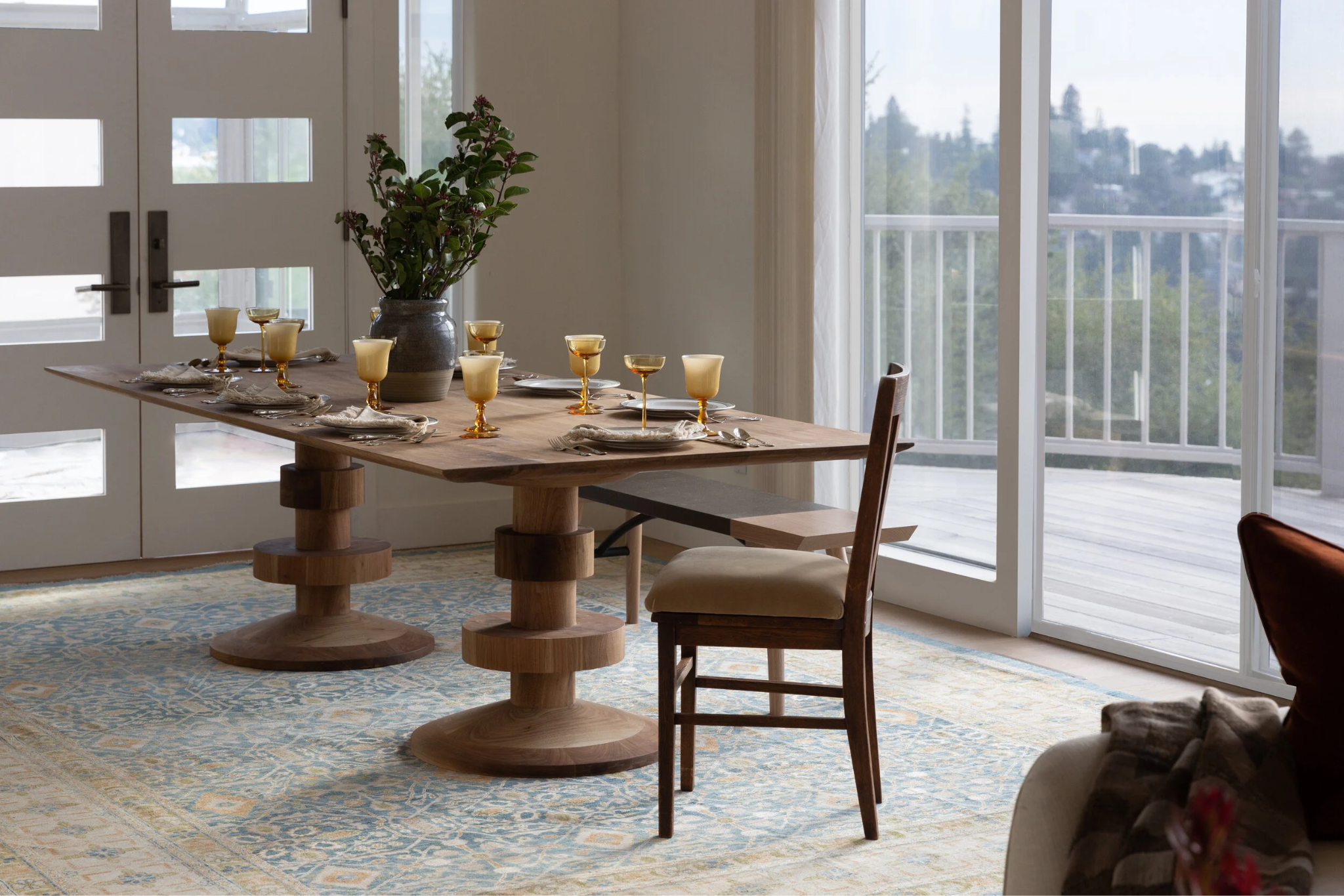 Custom walnut dining table by GUILD by LMI