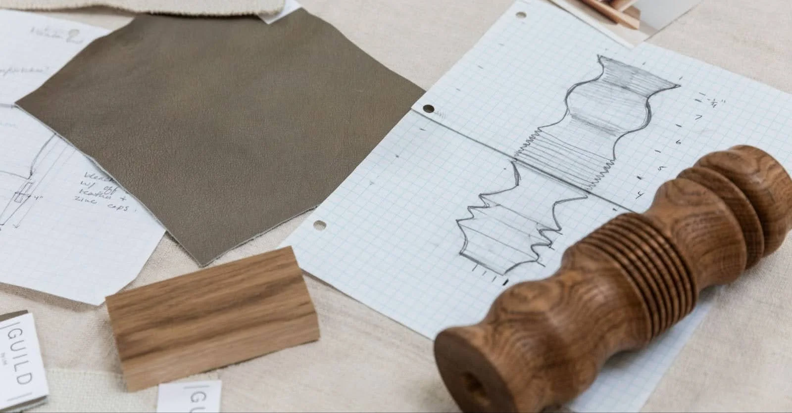 GUILD by LMI furniture collection including Rebecca chair, Monument side table, and sculptural wood pieces handcrafted in California