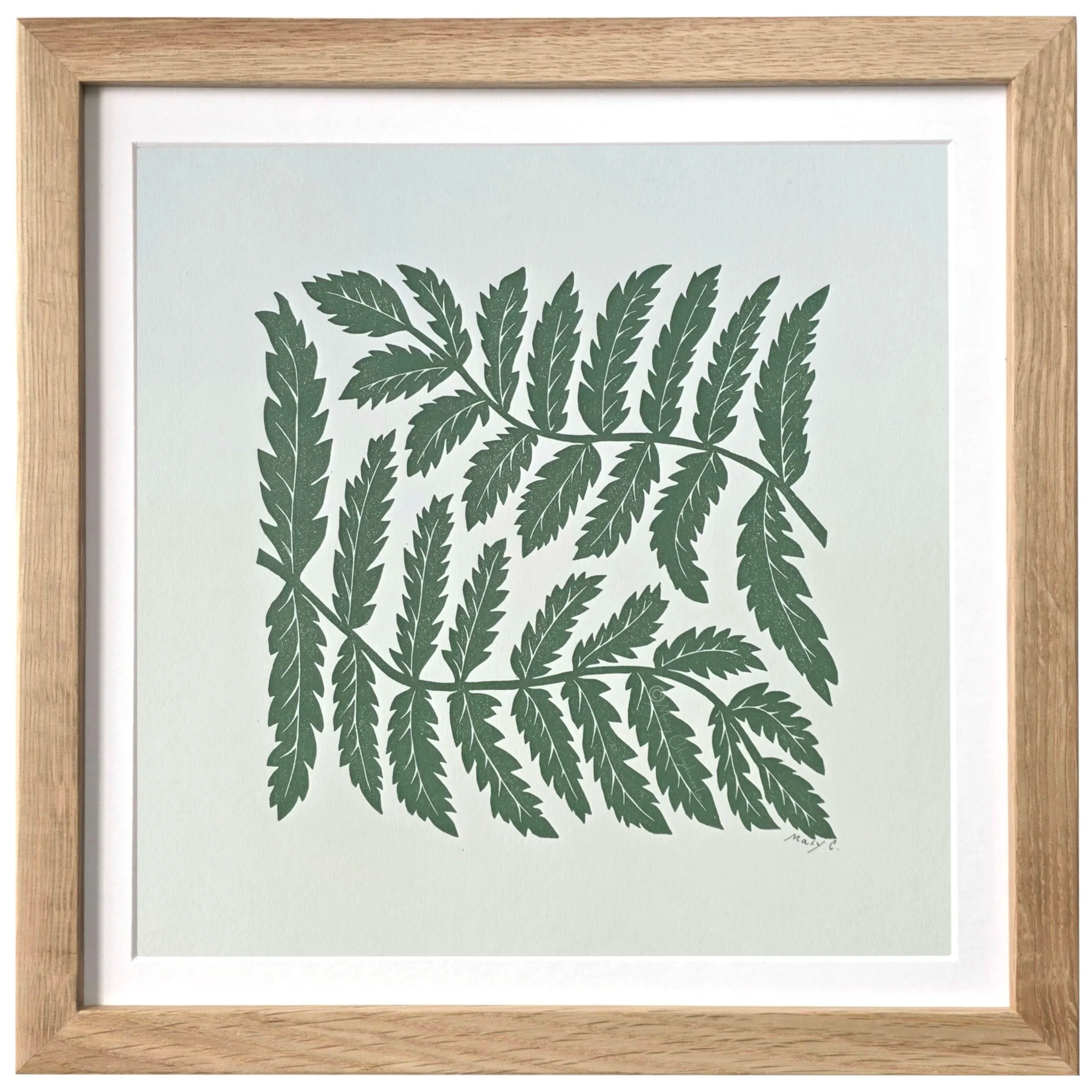 Nature-inspired 12x12 original block print featuring fern leaves, hand printed in olive green ink on off white fine art paper and framed in light wood.
