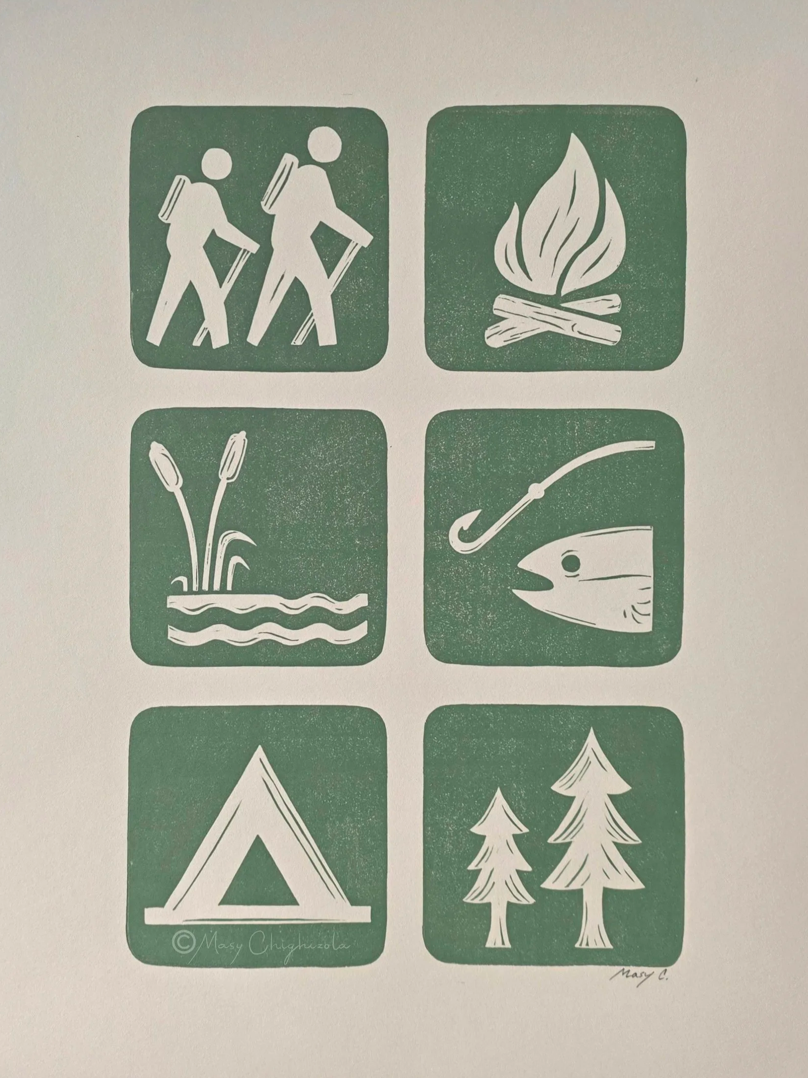 Hand carved linocut print with national park symbols, including hikers, campfire, fishing, tent, trees, and nature elements.