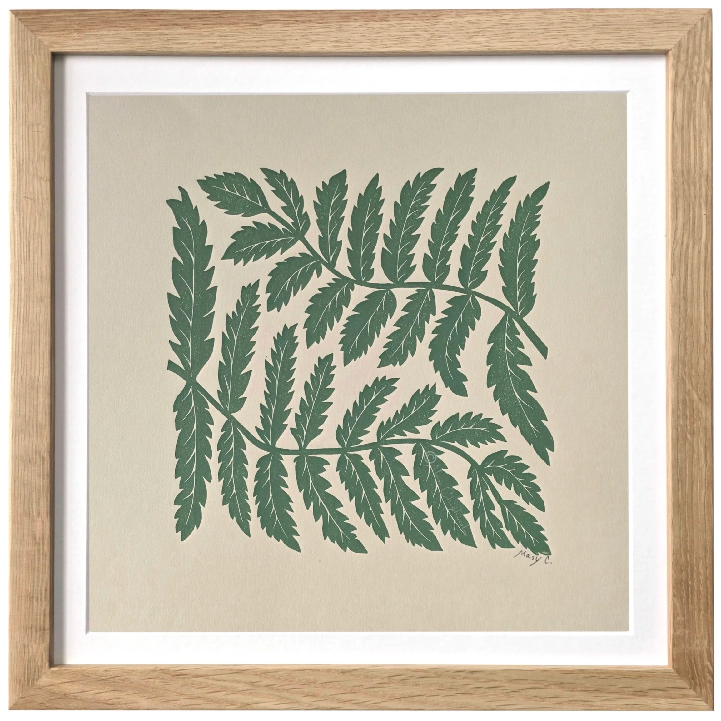 Nature-inspired 12x12 original block print featuring fern leaves, hand printed in olive green ink on beige fine art paper and framed in light wood.