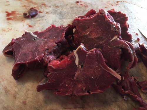 These are the frozen bits of meat I saved while cutting the steaks out of my deer. In this photo they are on their way to being 1.5 by 1.5 inch chunks.