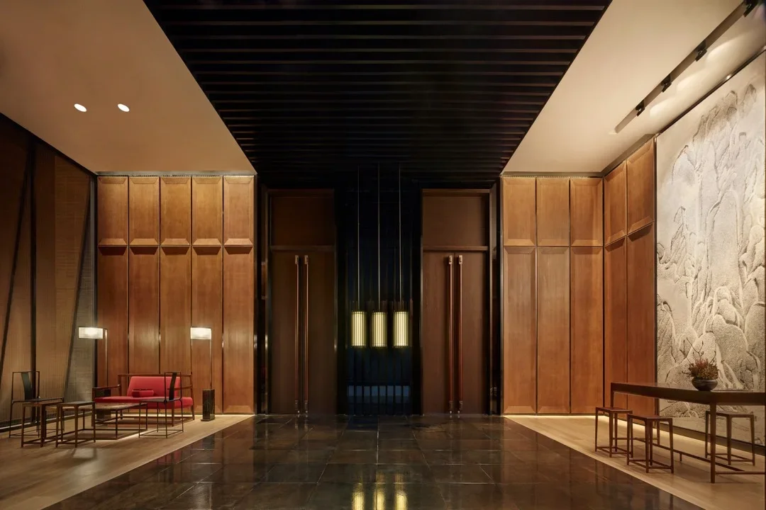 Warm timber-panelled hotel lobby and arrival hall