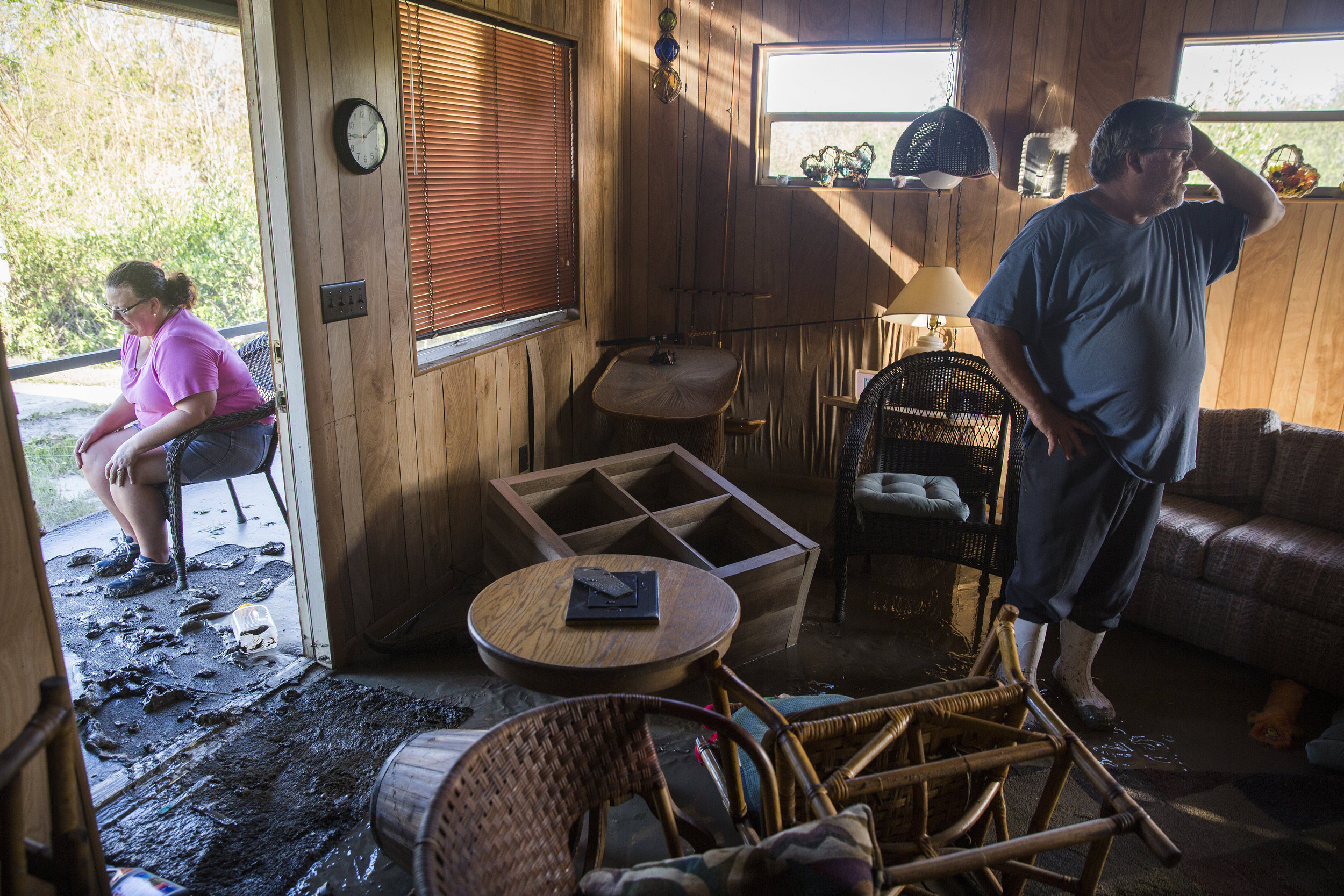  Robert Howard, right, and his wife Kathleen returned to their weekend home to find their furniture scrambled and the floor covered in a thick layer of mud in Plantation Island, an unincorporated area nearby Everglades City, as Collier County began p