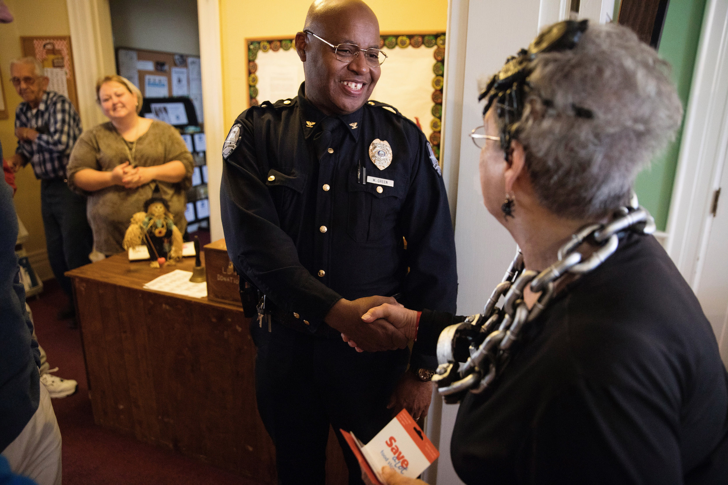  Wayne congratulates Ann Dragoo, the winner of the chili cook-off. As chief, Wayne takes pleasure in being present for community events like this where he can represent and be a face for the police department. 