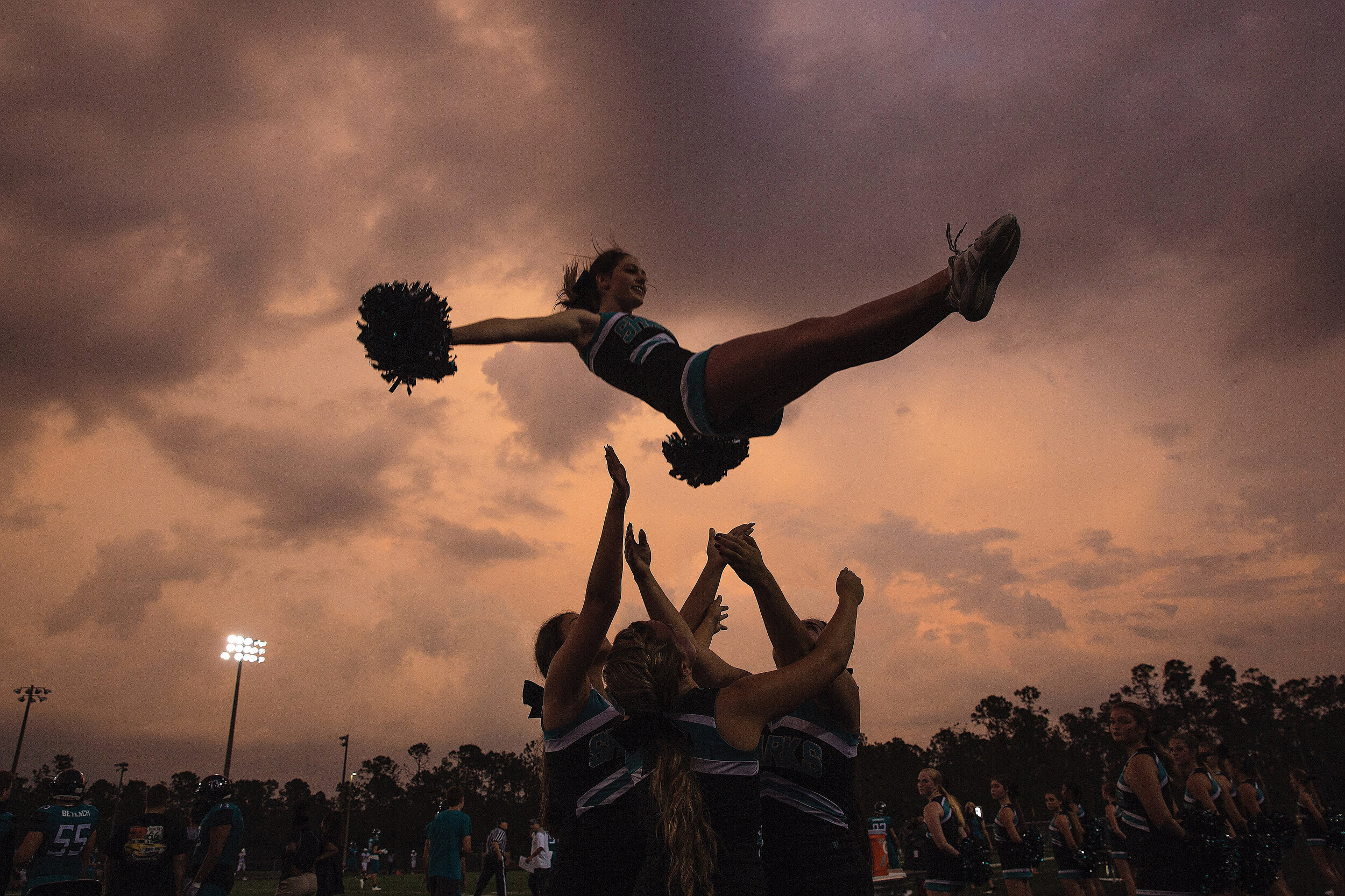  Gulf Coast High School cheerleaders pumped up the crowd at Golden Gate High School in Naples where the Sharks took on the Riverdale Raiders on Thursday, September 28, 2017. For Naples Daily News. 