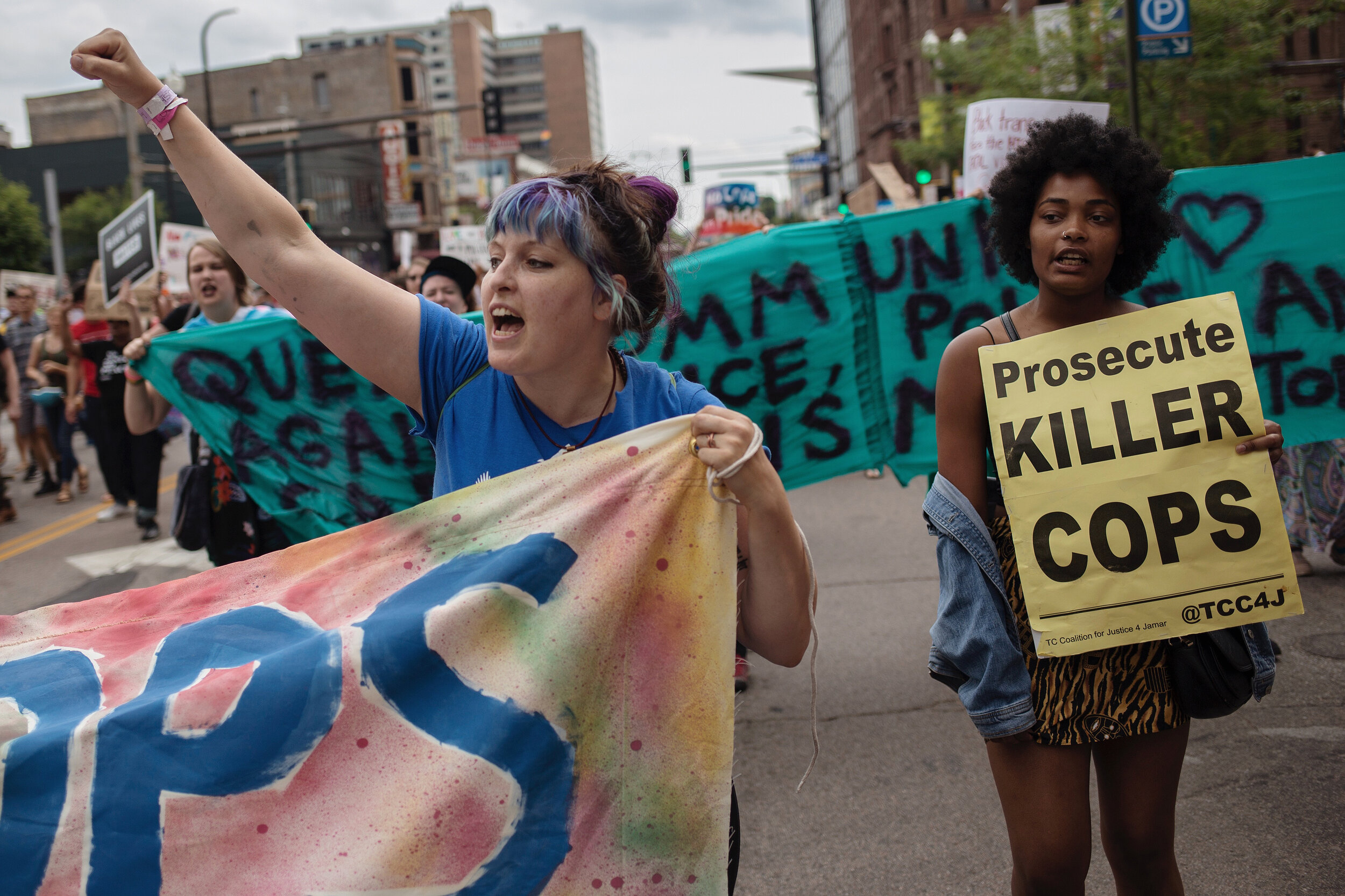  Protestors occupied Hennepin Avenue in downtown Minneapolis on June 24, delaying the start of the Twin Cities Pride Parade by almost two hours. The impassioned demonstrators called from the removal of police presence from Pride events, as well as ju