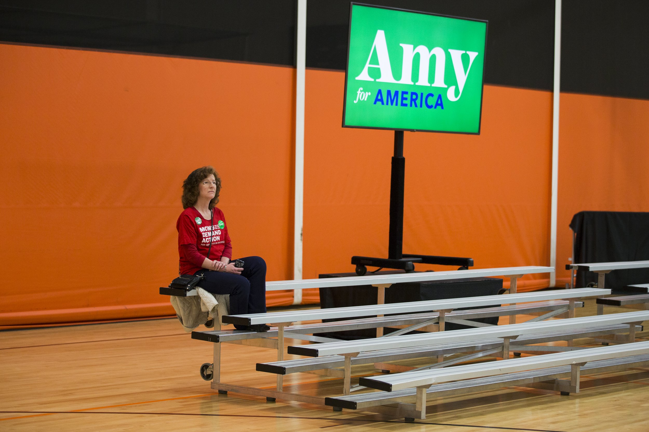  A supporter of senator Amy Klobuchar sits prior to her rally hosted at St. Louis Park High School on March 1, 2020. (Liam James Doyle for MPR News) 