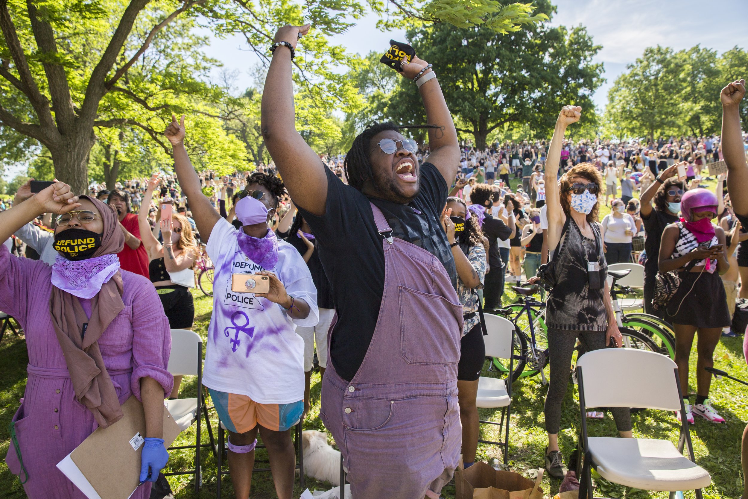  Oluchi Omeoga, center, from Black Visions cheers alongside a vast crowd that gathered at Powderhorn Park where nine Minneapolis City Council members declared their commitment to defunding and dismantling the Minneapolis Police Department alongside c