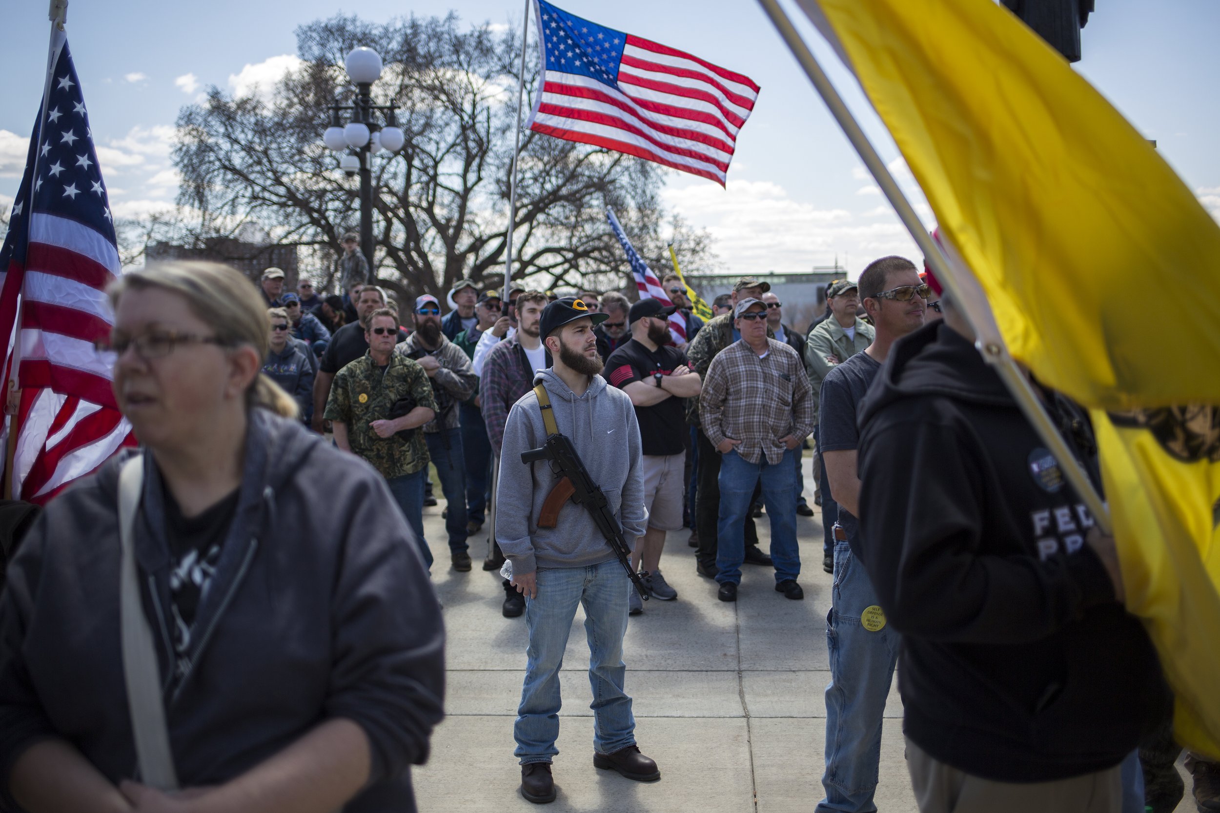  A man who asked not to be identified, center, sports a firearm alongside other demonstrators on the steps of the Minnesota Capitol building in St. Paul on Saturday, April 28, 2018. The rally, organized by the National Rifle Association and the Minne