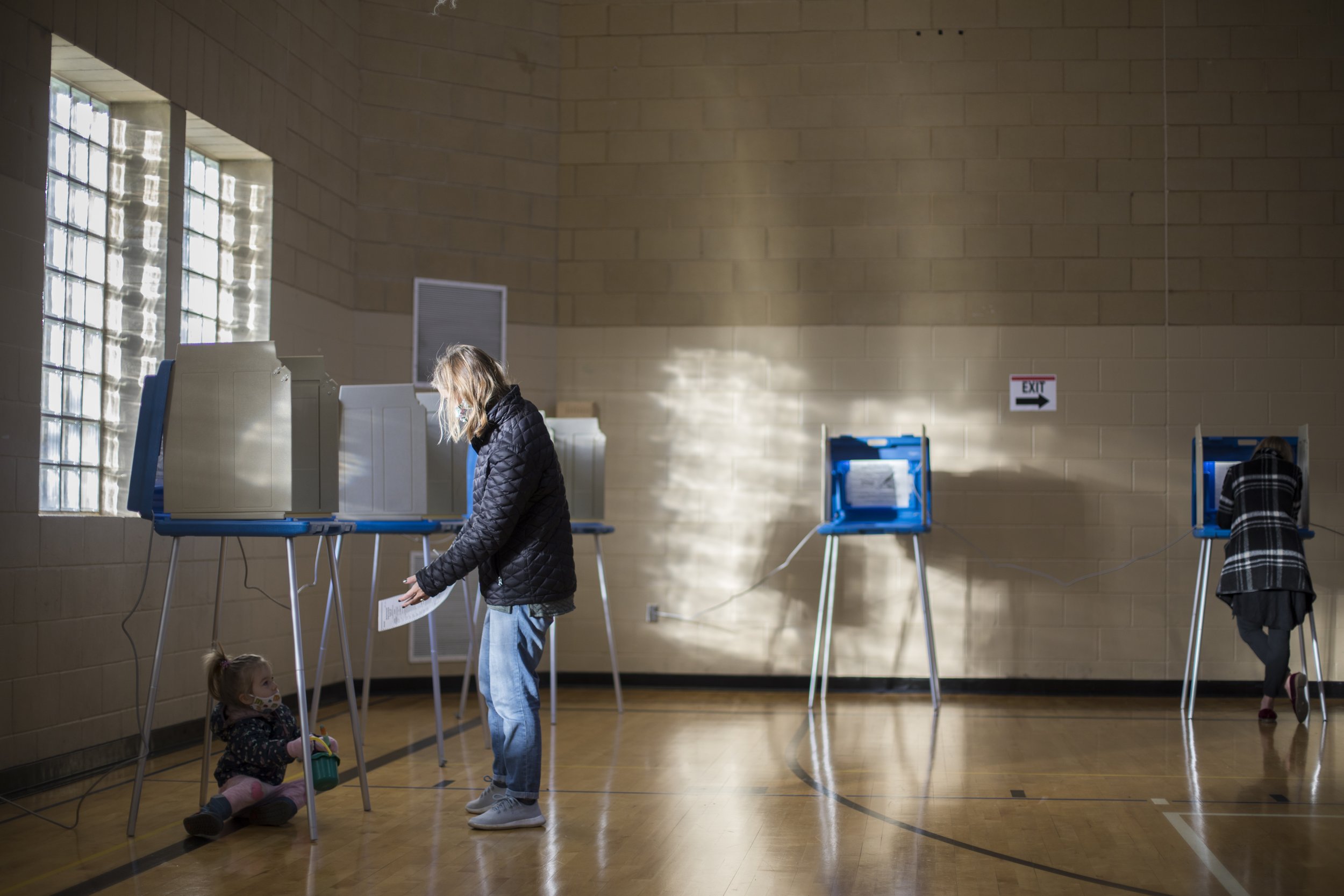  Community members cast their vote for the 2020 Presidential Election at the East Side Neighborhood Services polling place in northeast Minneapolis on Nov. 3, 2020. (Liam James Doyle for MPR News) 