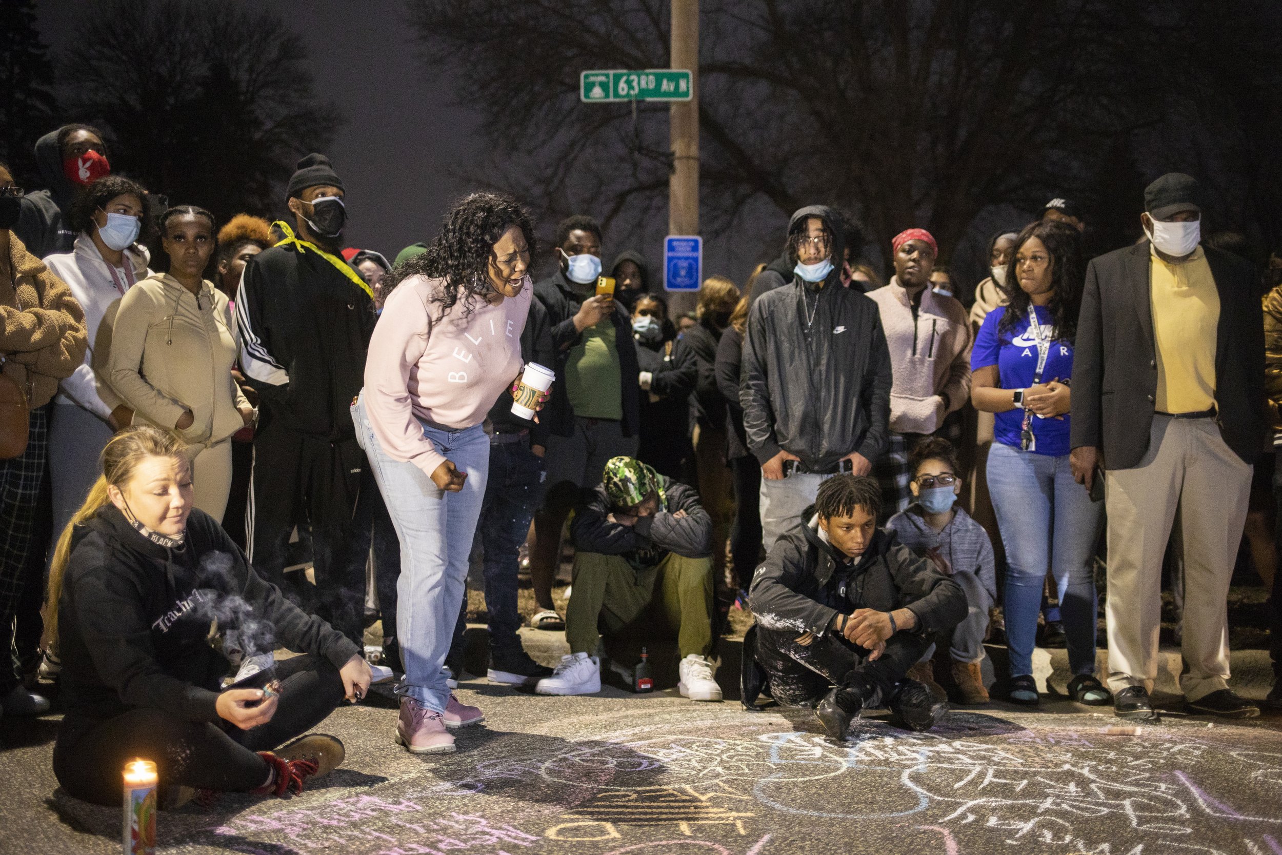  A crowd gathered on Sunday night, April 11, 2021, near the scene of a traffic stop-related police shooting in Brooklyn Center, Minn. The driver’s mother said officers had pulled over her son because he had air fresheners hanging from the rearview mi