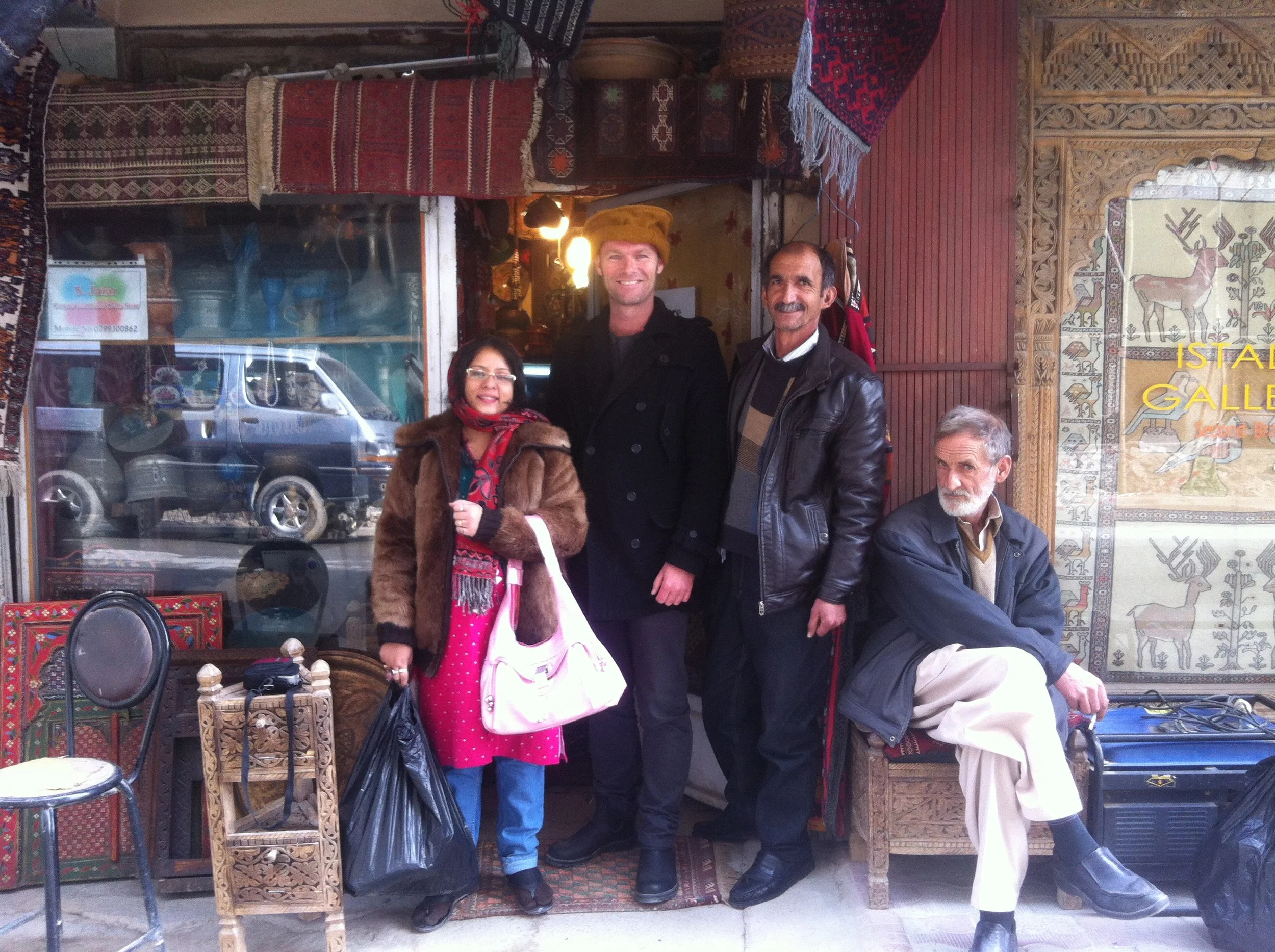 Me with two ANIM colleagues and an elderly merchant on Chicken Street in Kabul, 2015. 