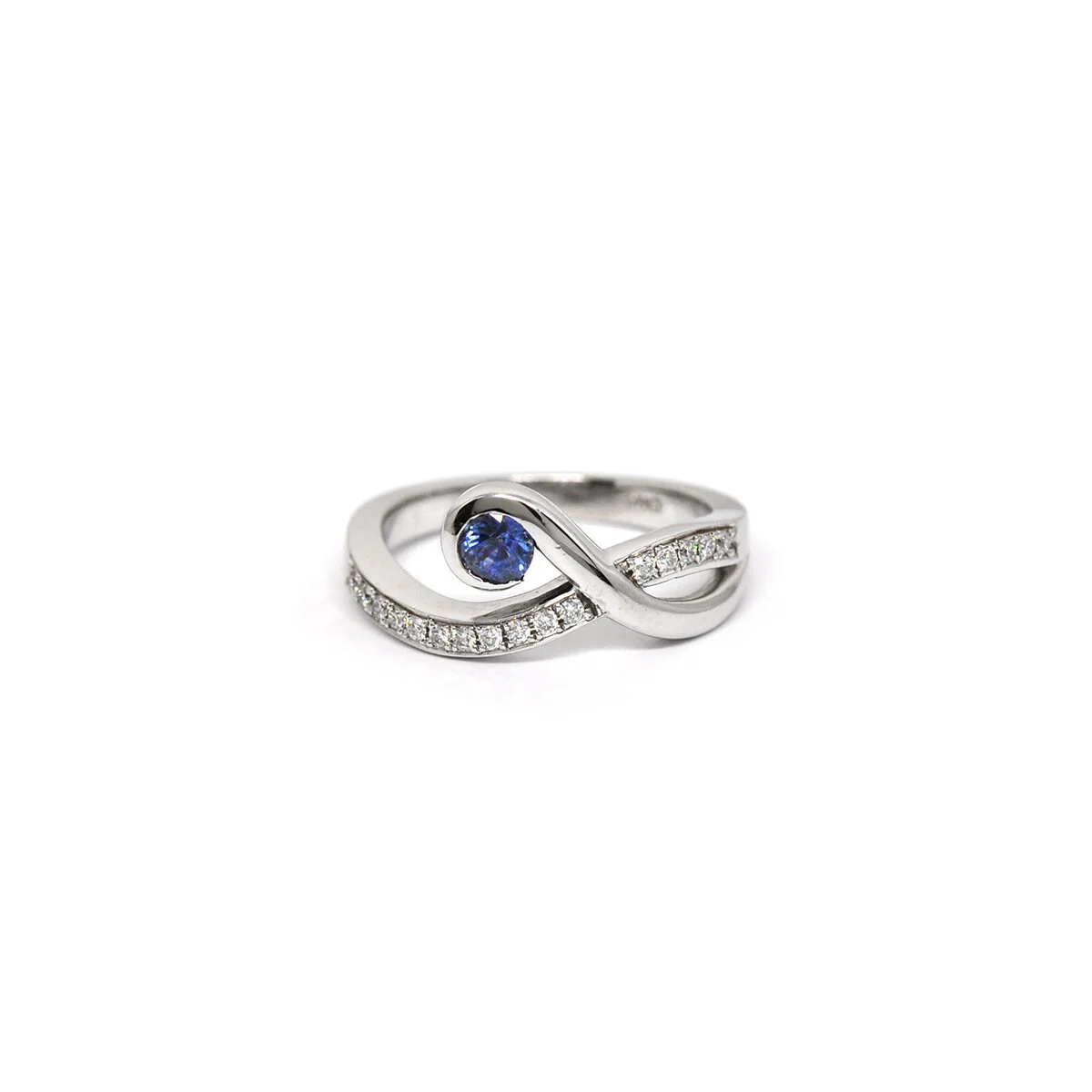 SWEEPING WHITE GOLD, DIAMOND & SAPPHIRE RING