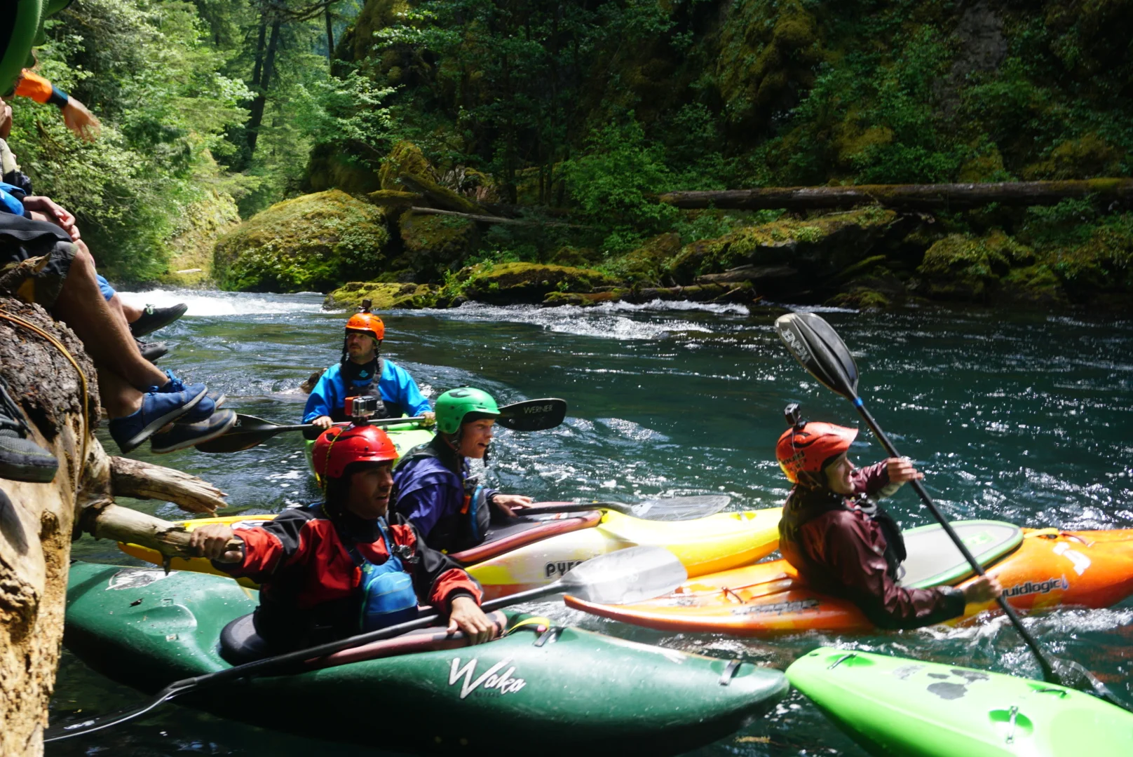 Paddlers watch a stylish line off Wishbone ( Photograph by Adam Edwards).