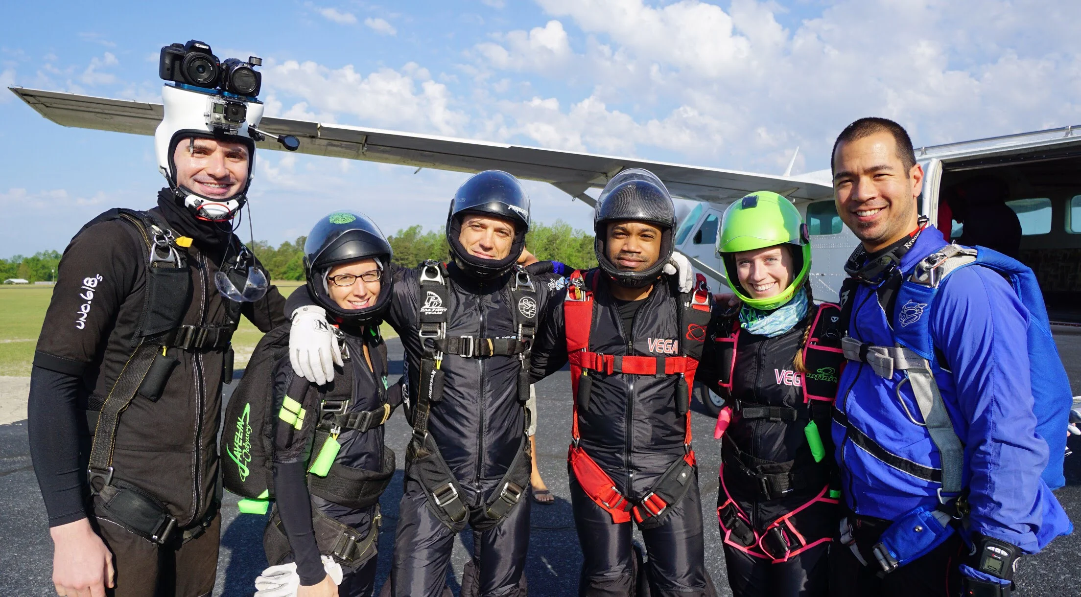 Nick (3rd from right) poses for a photo along with Vega XP team members at a drop-zone in North Carolina. Photo credit: Elliot Byrd