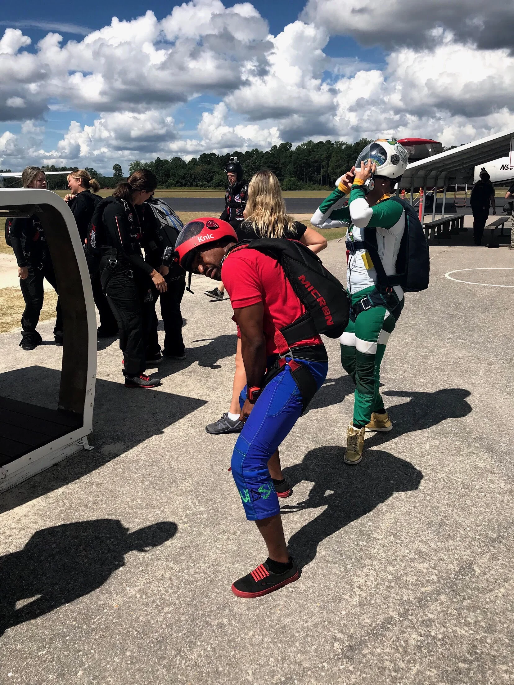 Nick adjusts the straps on his parachute rig prior to boarding the jump plane in North Carolina. Photo credit: Danielle Williams