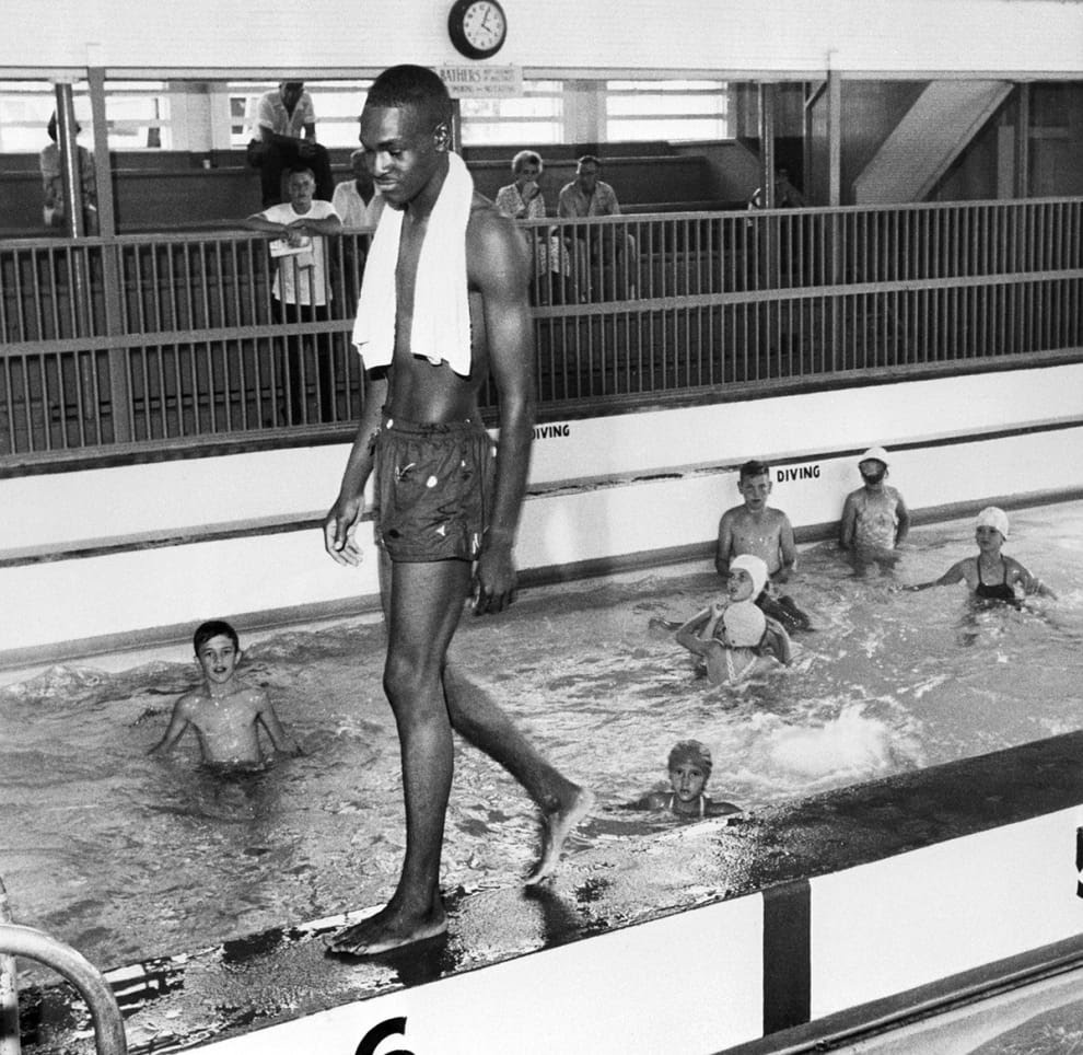 David Isom breaks the color line at a whites only swimming pool in Florida, June 1958. White officials responded by—you guessed it!—closing the pool. Getty Images