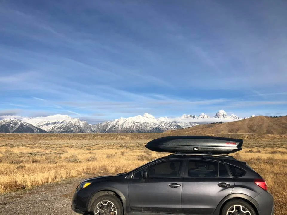 My car and home in front of Grand Teton National Park, WY.