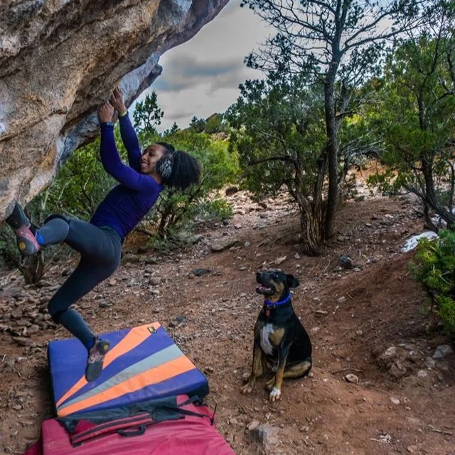 Dr. Favia Dubyk enjoys bouldering with her crag dog Hans. Photo courtesy of Favia Dubyk