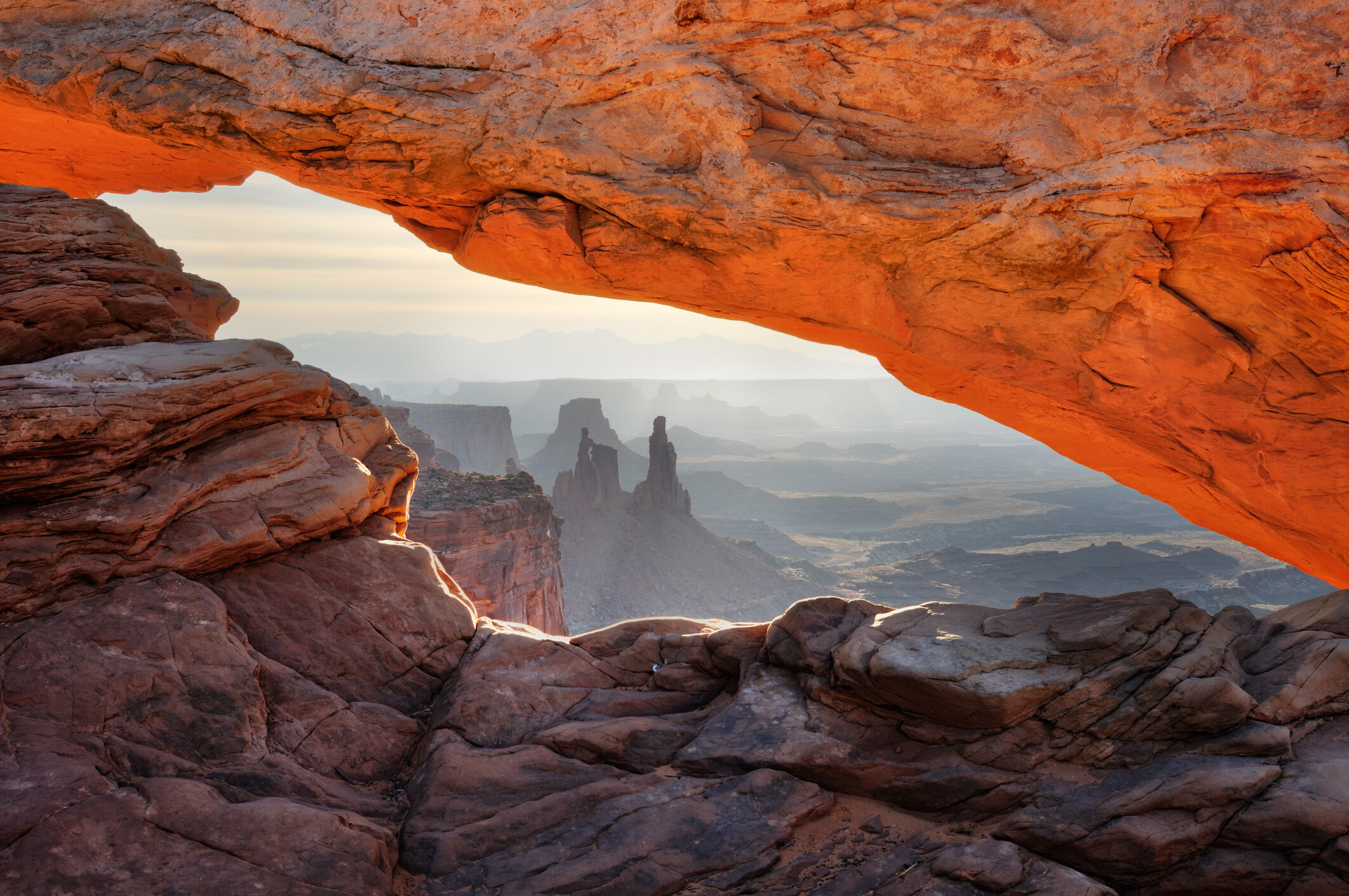 Mesa Arch is located in Canyonlands National Park in northern San Juan County, Utah on Núu-agha-tʉvʉ-pʉ̱ (Ute) land. Photo by Rezus/iStock / Getty Images