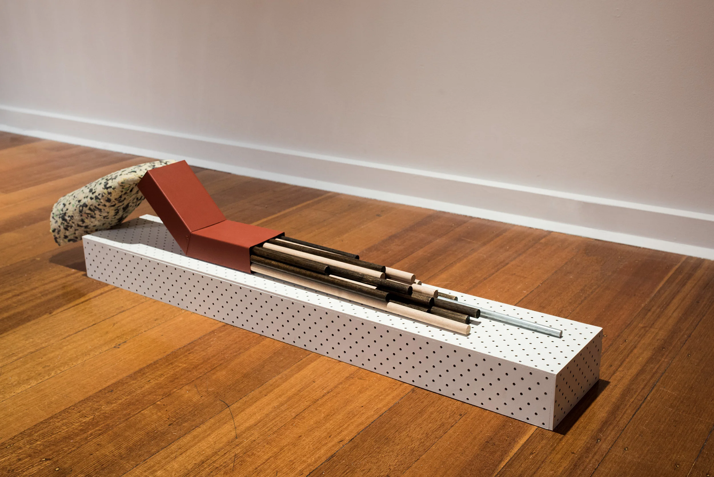   The Repositioning of an    Object that Once Functioned II &nbsp;(2017)  Steel, Wood, Lacquer Paint,  Carpet Underlay and Glass  110cm x 20cm x 26.5cm&nbsp;  Image Credit: Guy Grabowsky    