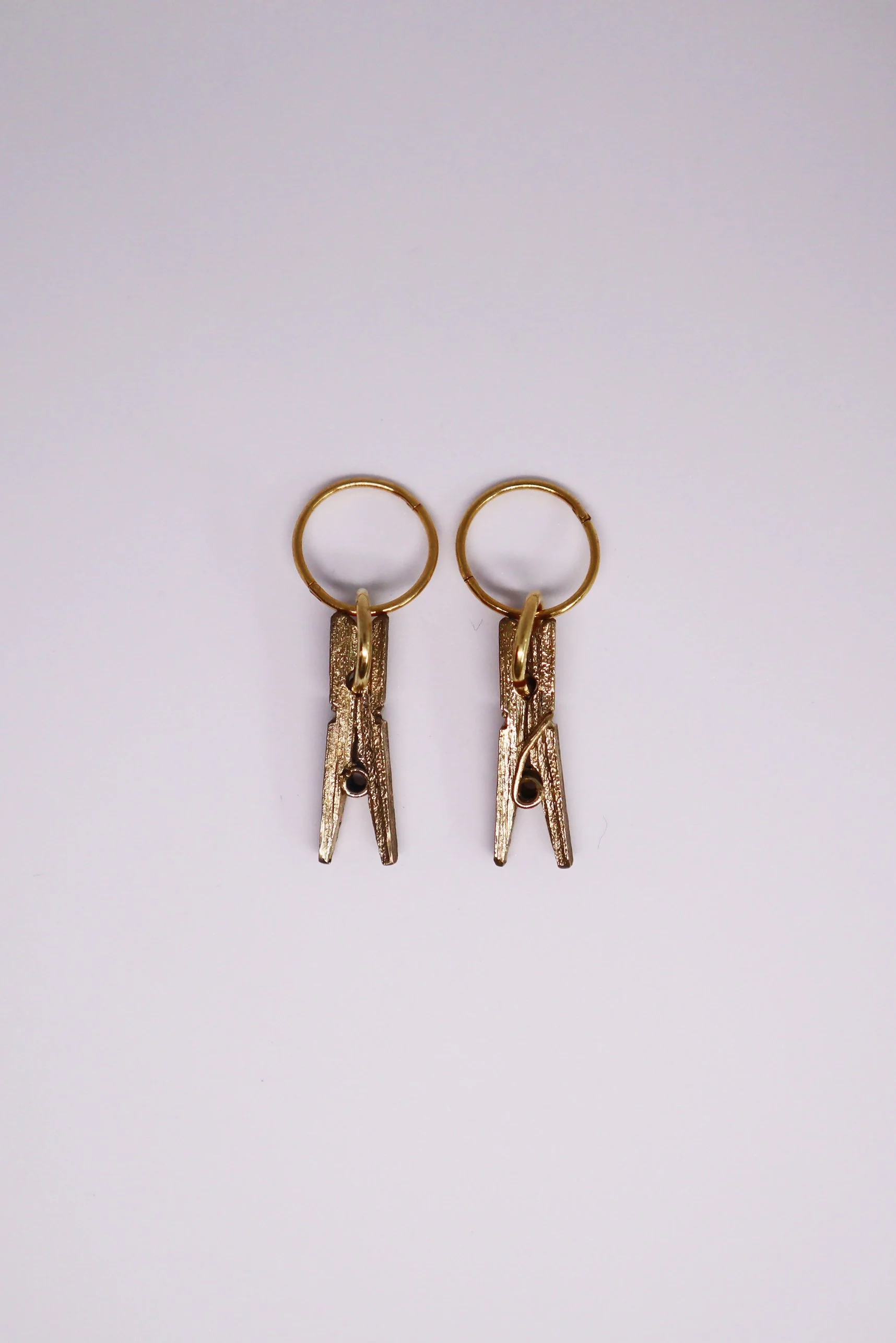 PeggyGoogenheimEarrings-Brass-TopView1-SeanMcDowell.jpg