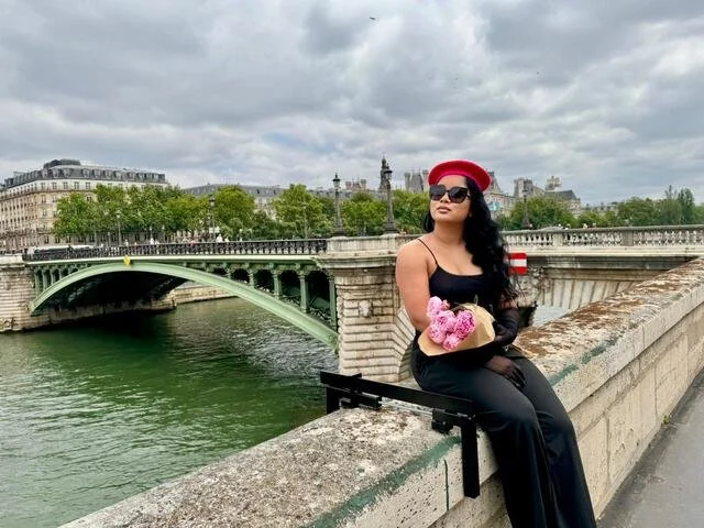   Posing in front of the Seine River  