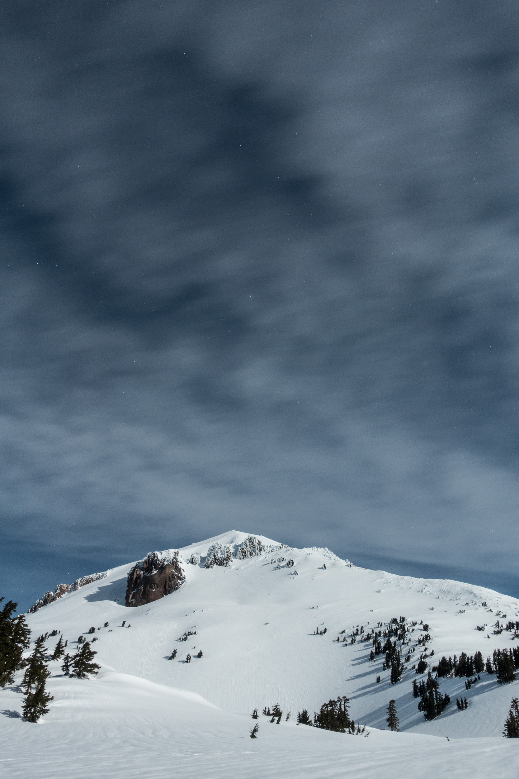  Lassen Peak in the winter, taken from camp the night before my summit. The summit block is the icy peak cresting above the right shoulder. Lassen Volcanic National Park, California.&nbsp; 