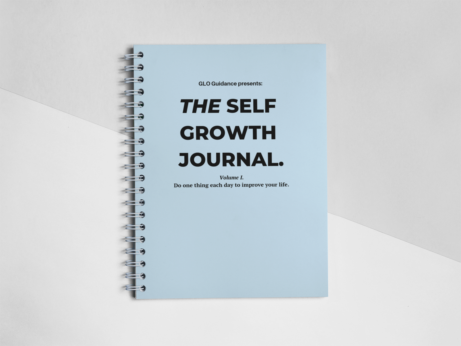 frontal-shot-template-of-a-spiral-notebook-lying-on-a-bicolor-surface-a15308 (3).png