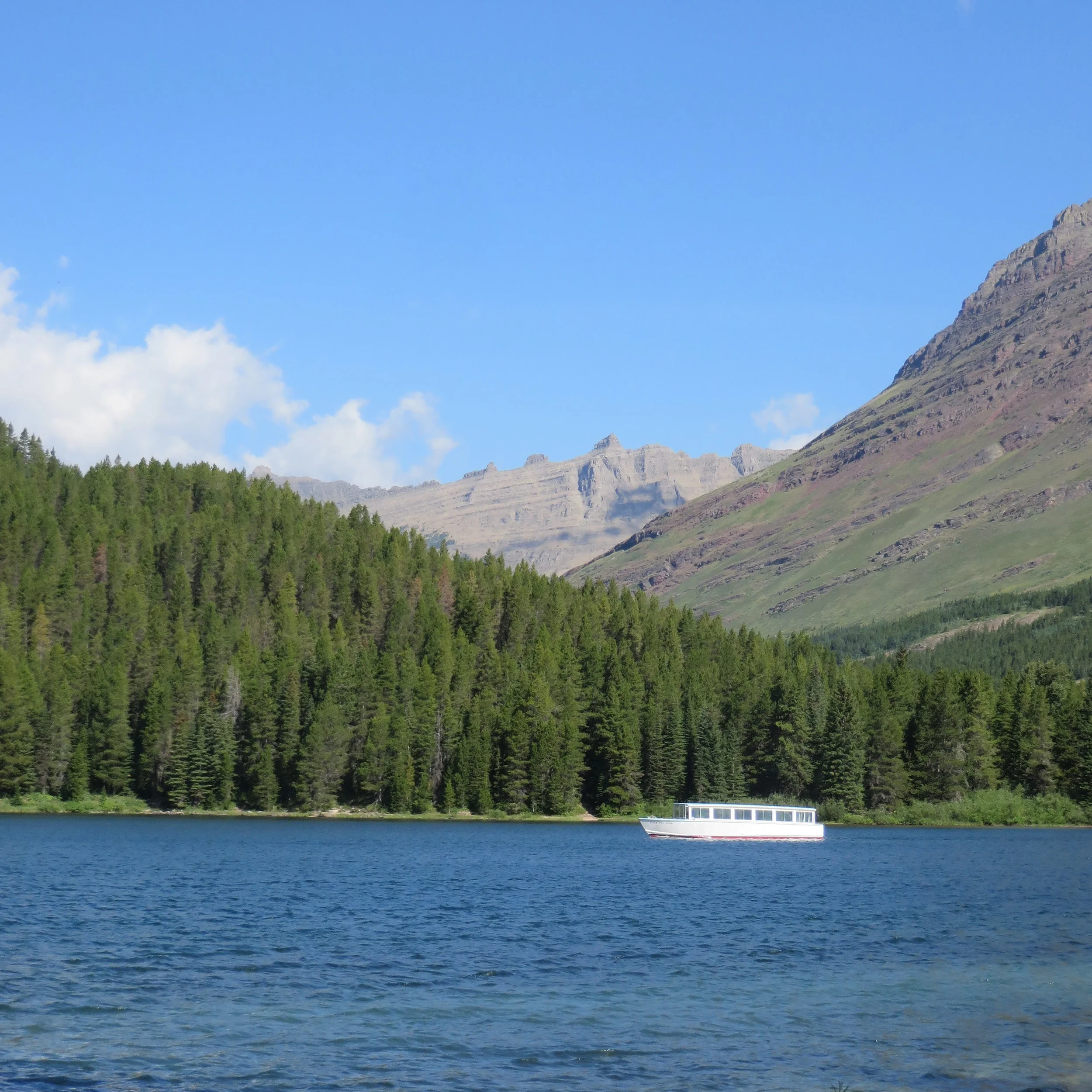 Chief Two Guns crossing Swiftcurrent Lake in Many Glacier.