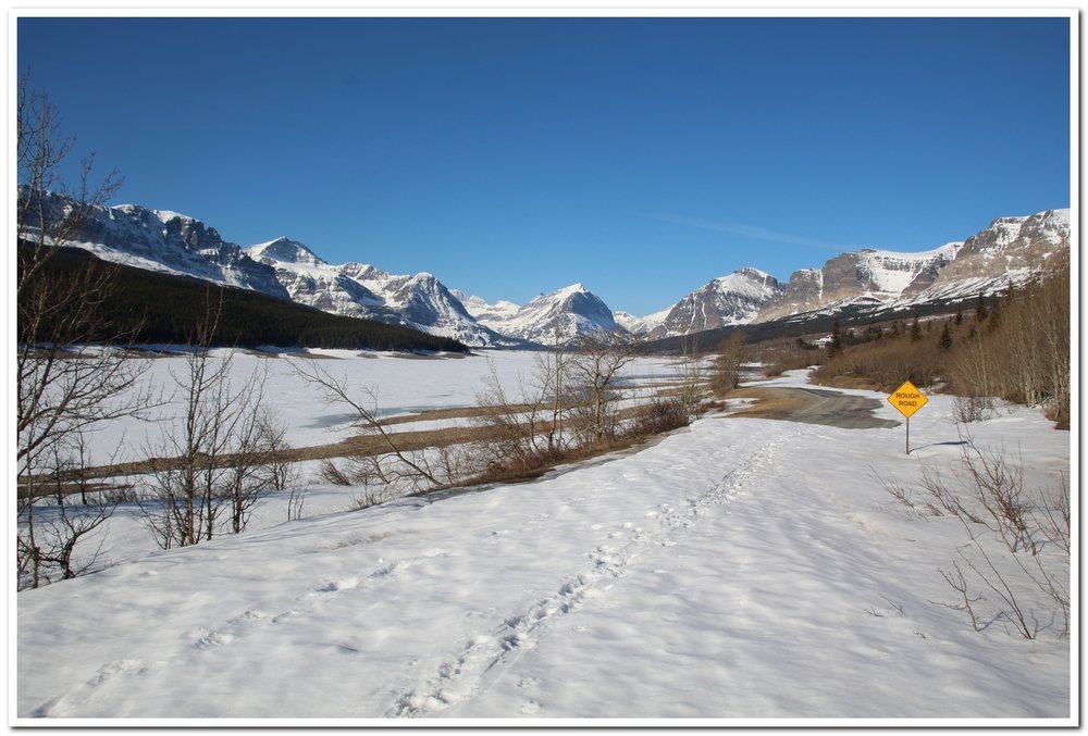 We anticipate this being the smoothest condition of the year for the Many Glacier Road