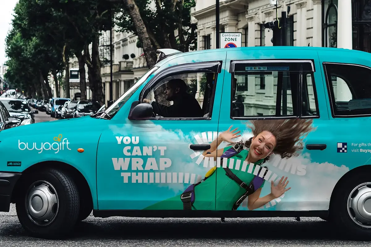 Buy a Gift campaign commercial photography for Make Us Care taxi wrap branding