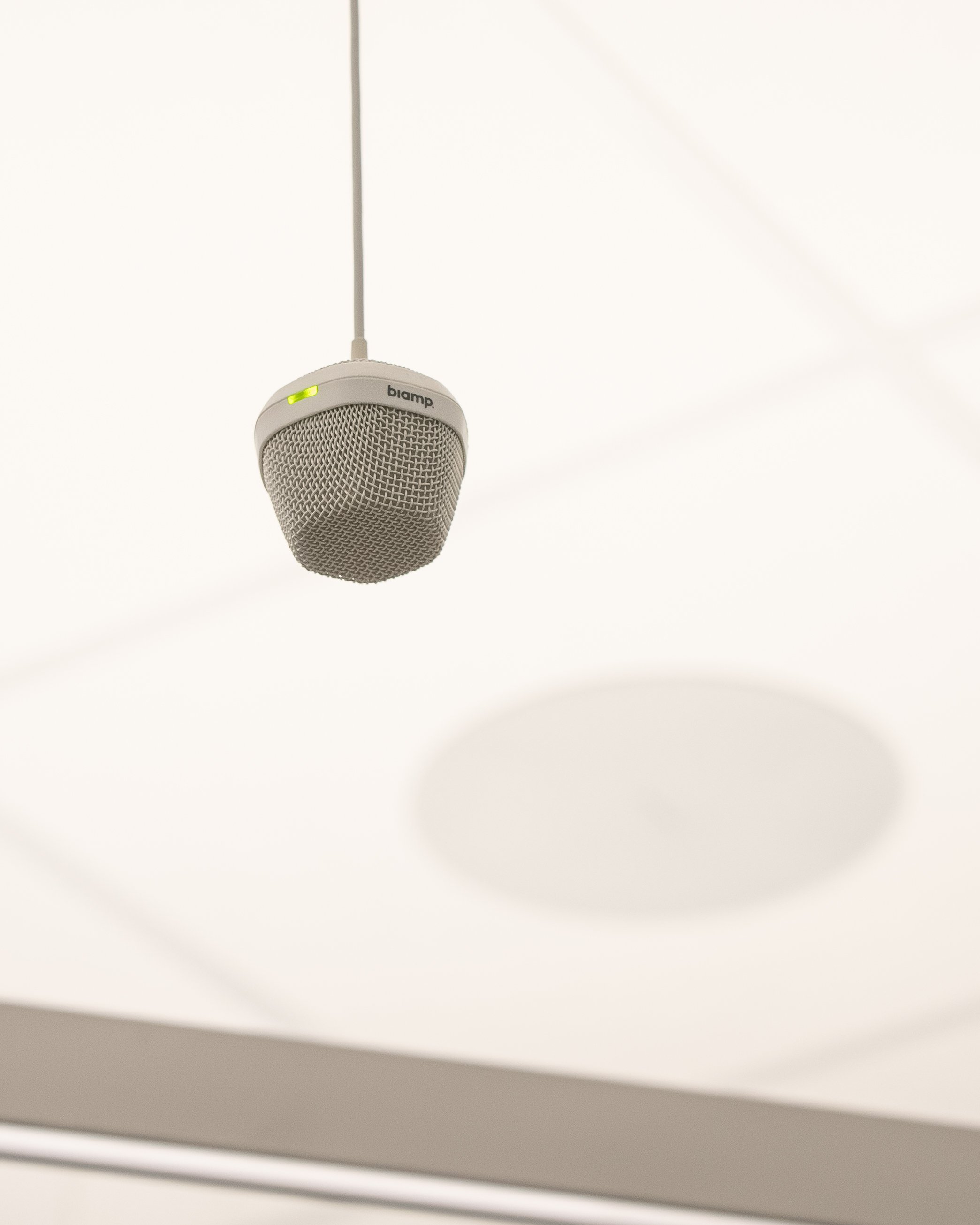  A ceiling mounted Biamp microphone.  