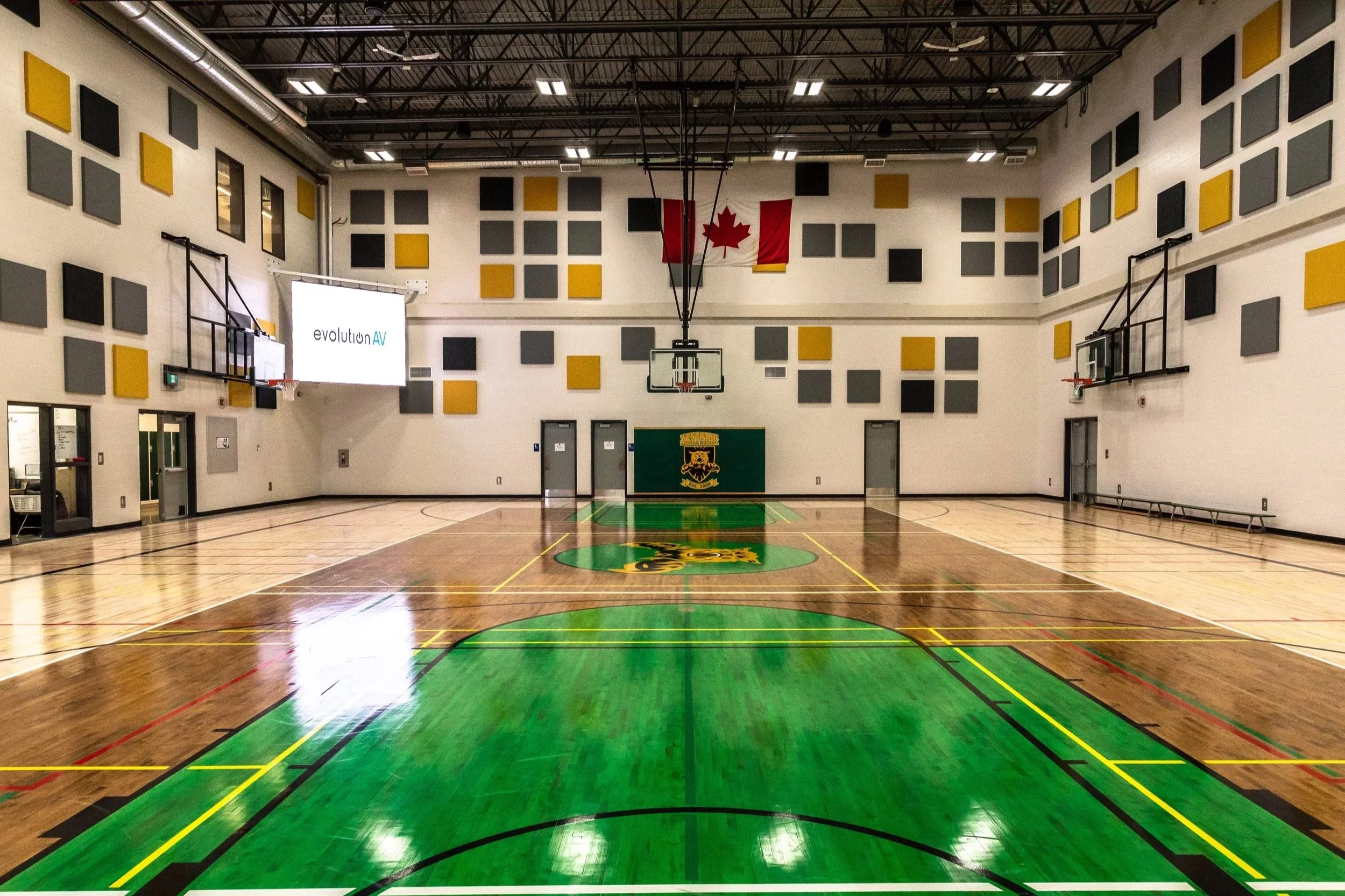 Acoustic Panels in a school gymnasium reducing noise
