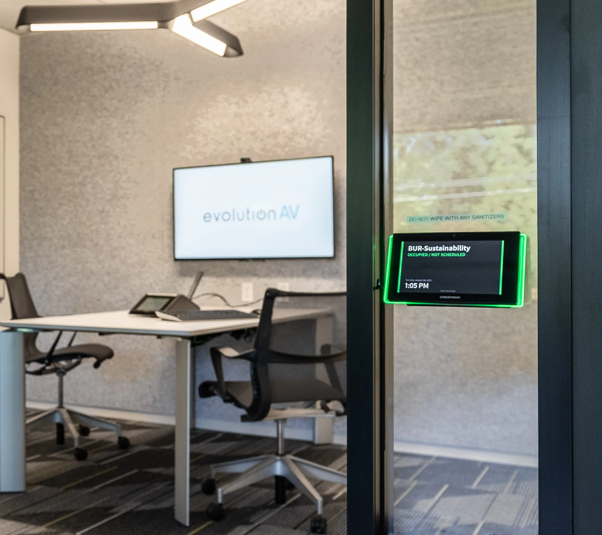 Small office meeting room scheduling panel.