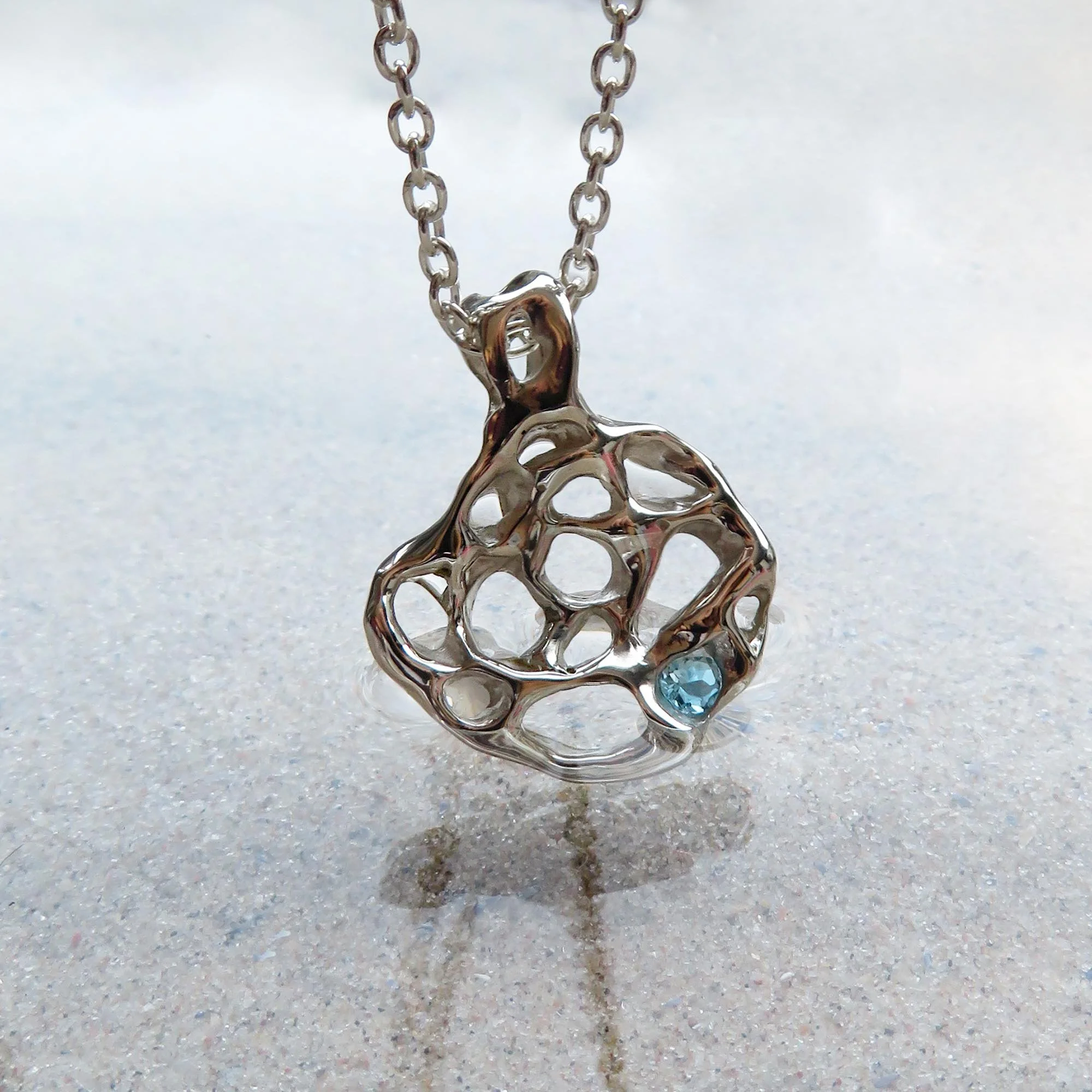 Unisex silver handmade seaside nature inspired jewellery made in the uk designer unique affordable contemporary modern unusual jewelry blue topaz pendant