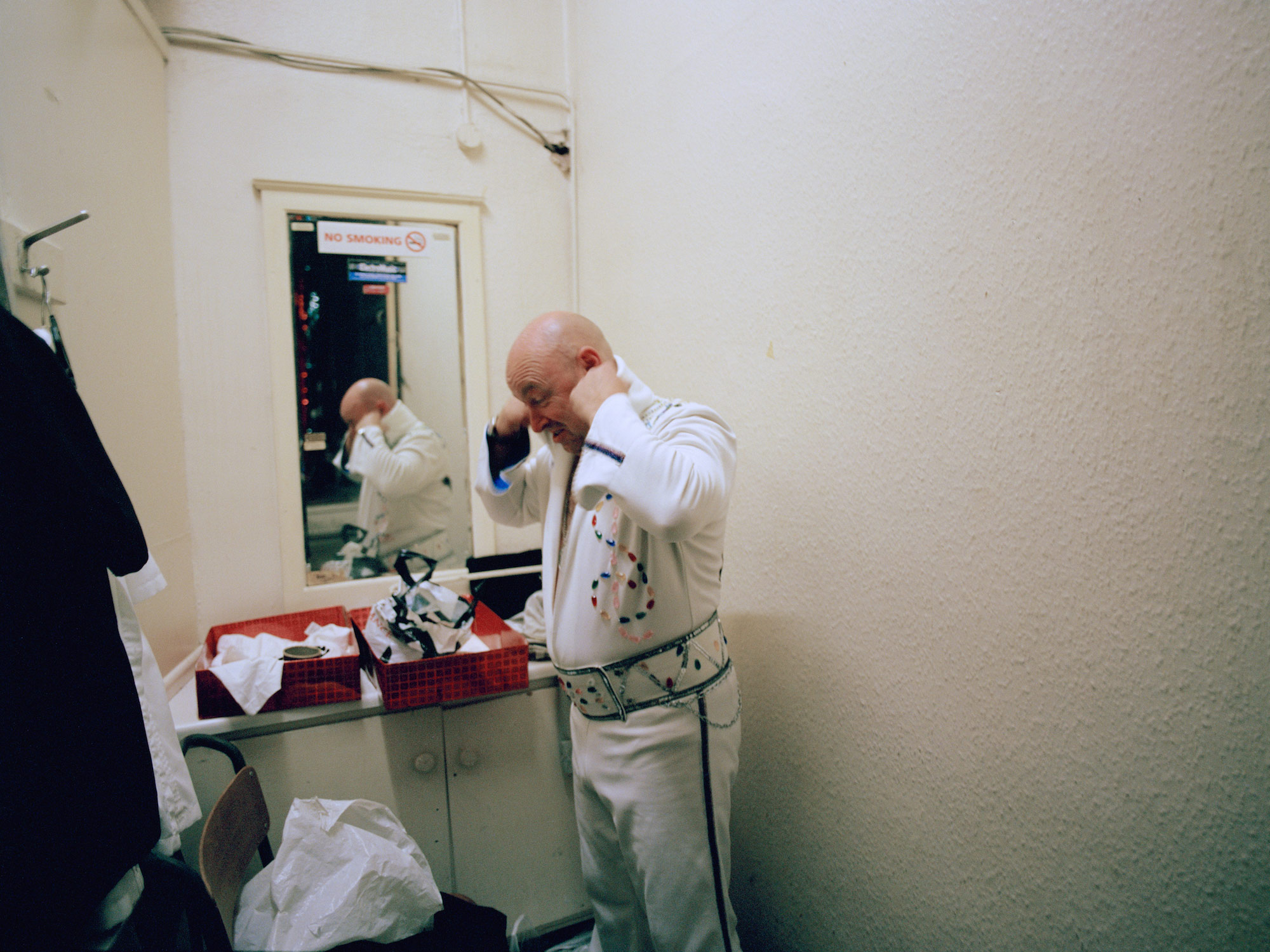 My Father preparing backstage to perform his Elvis tribute act, Boothys Working Men's Club, Mansfield, Nottinghamshire.