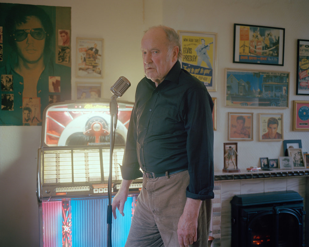 Stephen, an ex-miner and Elvis Presley fanatic, at home with his 1950's jukebox.