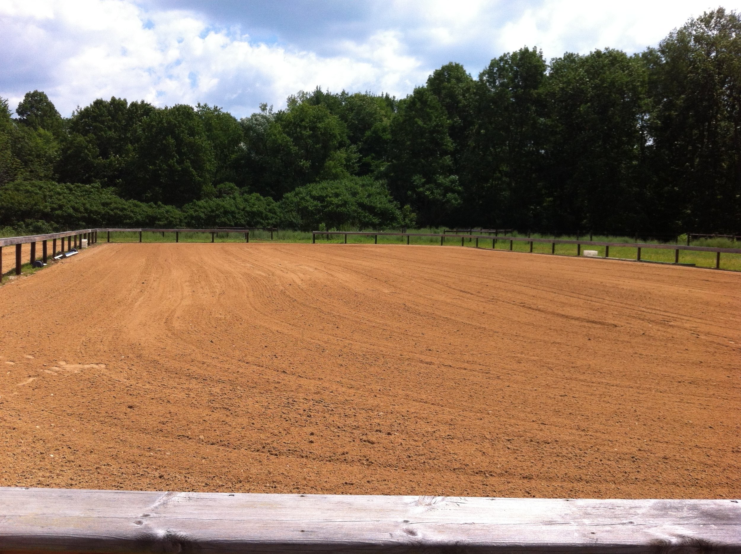  80x100 outdoor arena with limited bleacher seating 