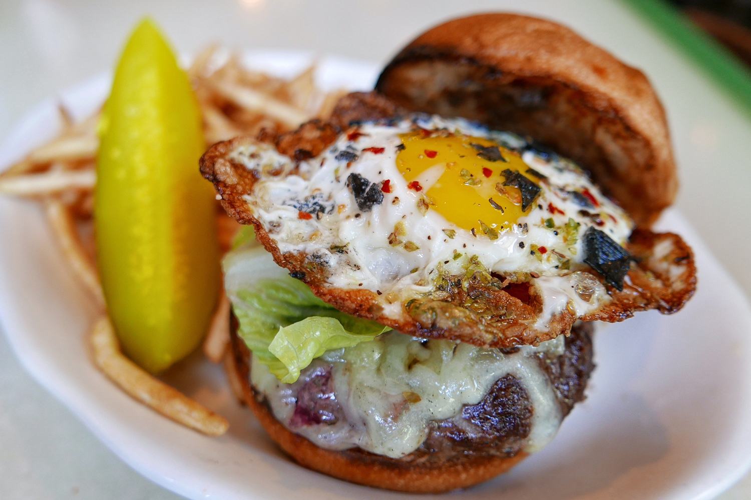 The Lil Frankies Hamburger with Fontina Cheese, Lettuce and Tomato and a Crispy Egg on Top French Fried