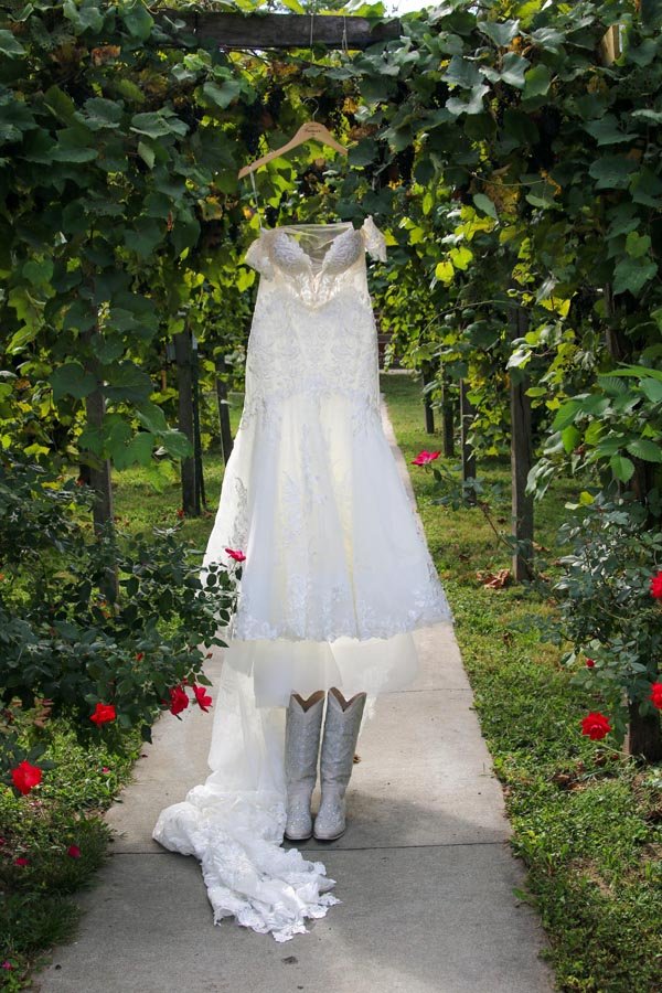 Wedding Dress hung ready in the vineyard at Mallinson Vineyard and Hall.jpg