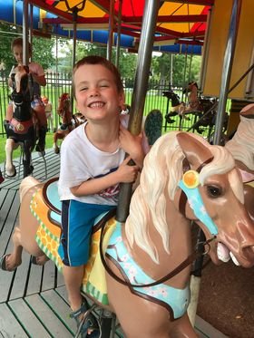 boy on carousel.jpg