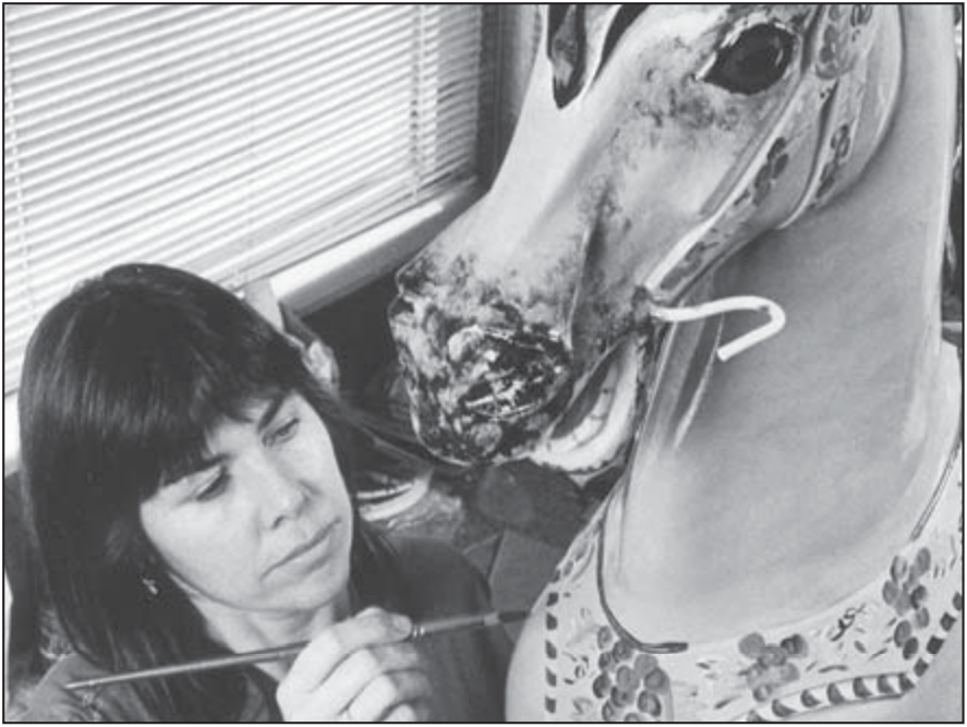 Annie Campbell painting a horse 1986.png