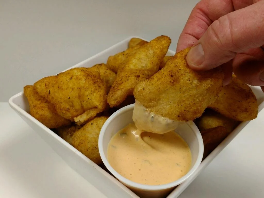 CAJUN PUFFS The perfect appetizer with your pizza! These spicy snacks are Piper’s house-made dough, fried and tossed in our Cajun seasoning, then served with our Zing sauce. $6.95