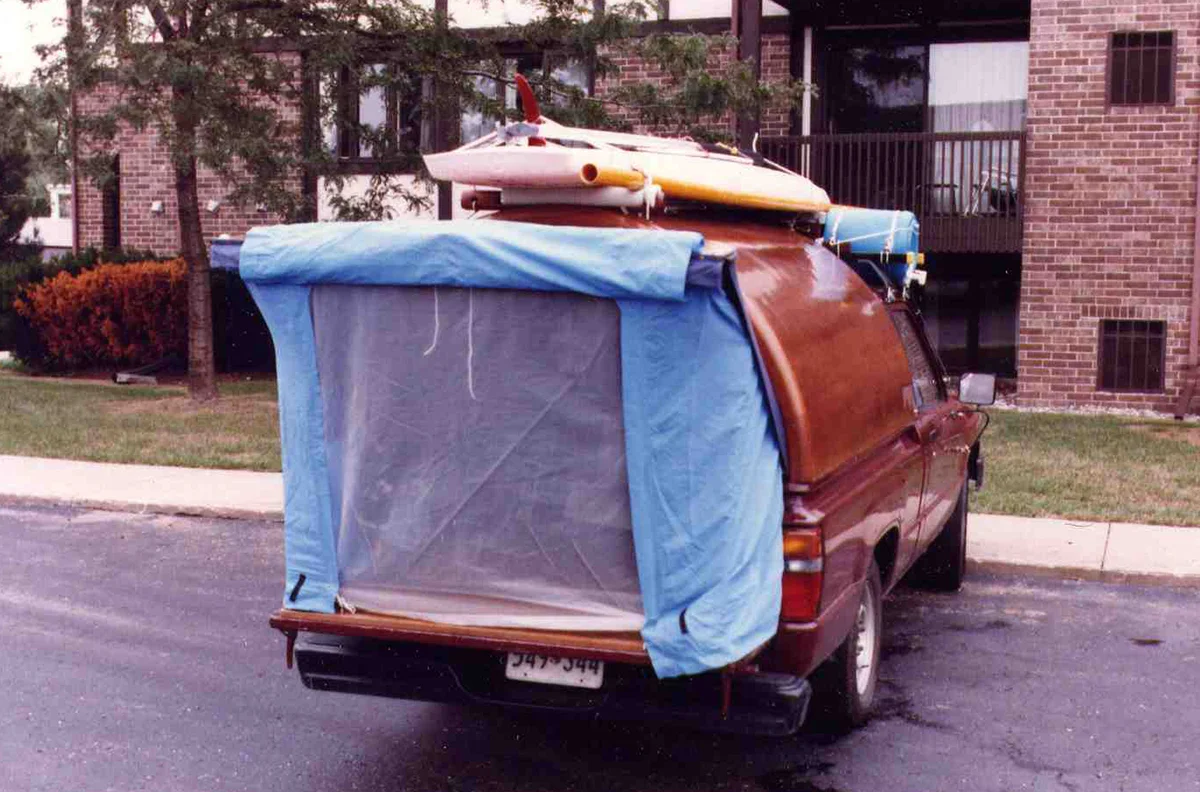 The door was hung on a single giant Soss hinge and locked open with an arm that reached down both sides. The tent snapped on with camping gear clips