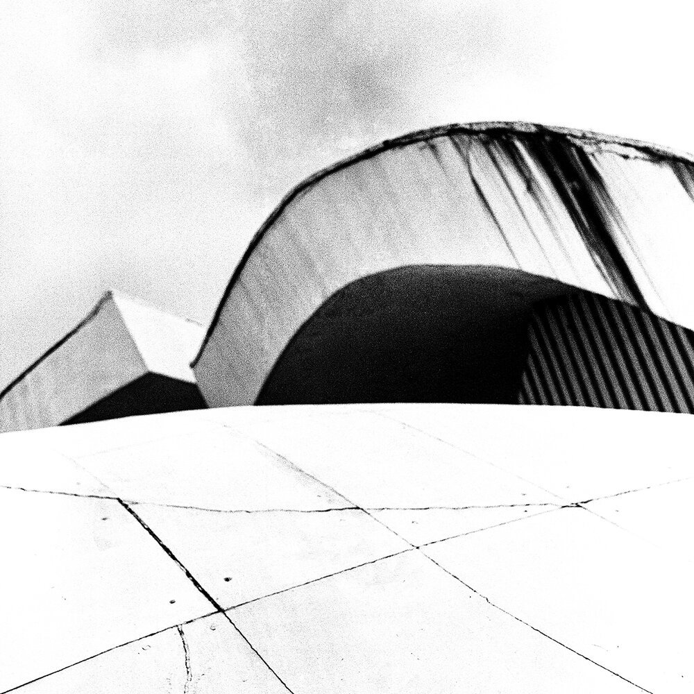 Artistic black-and-white photography explores Brutalist philosophy and architecture.