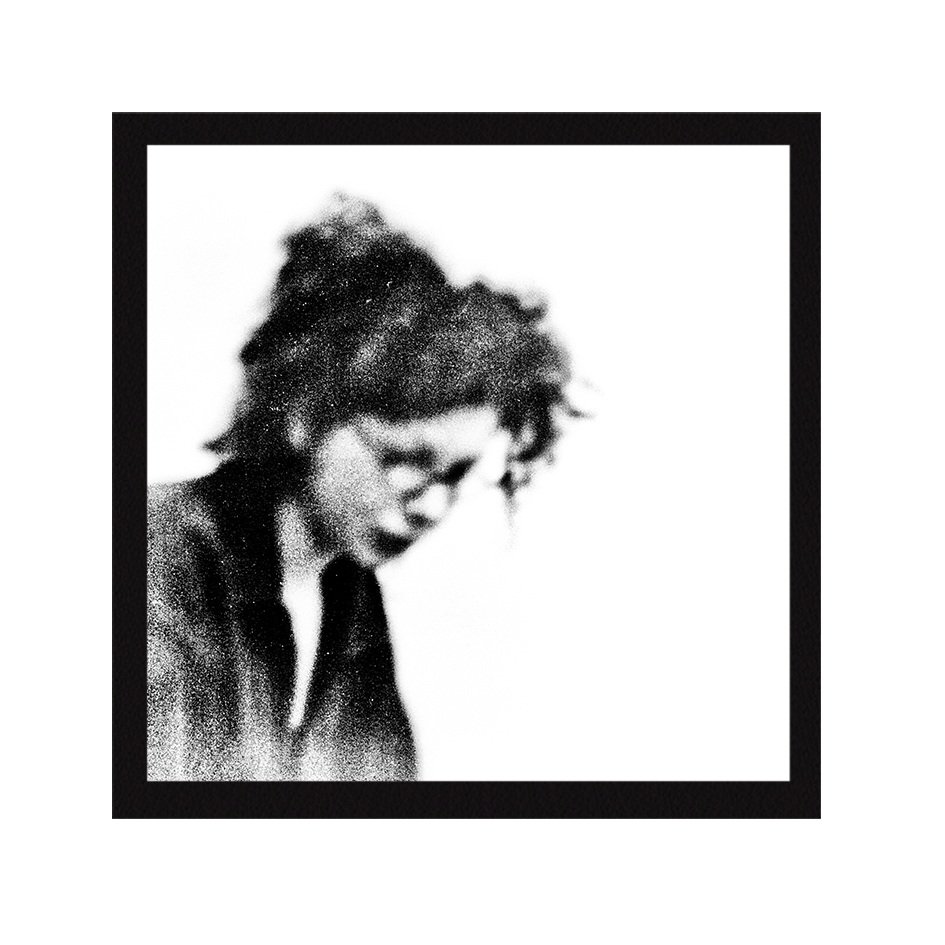 Black and white abstract photography of a lone figure in motion, dissolving into a stark, textured, and dreamlike background.